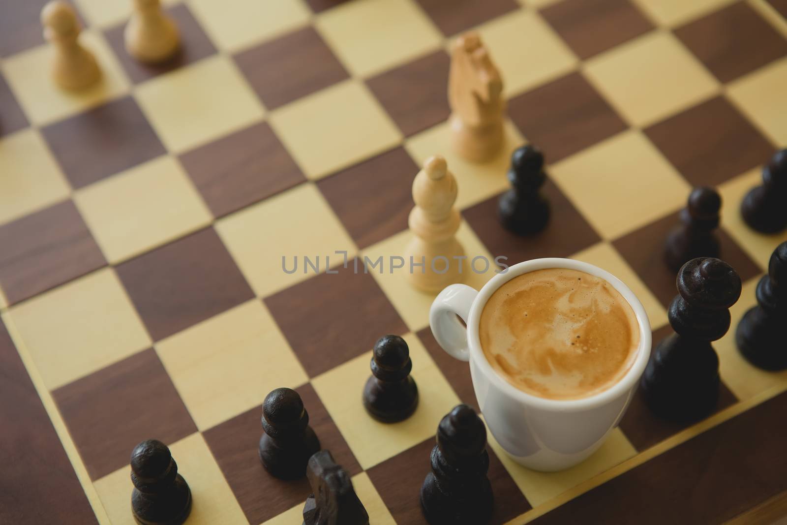 Leisure relax time or business strategy concept. Part of chess table with coffee cup hot drink 