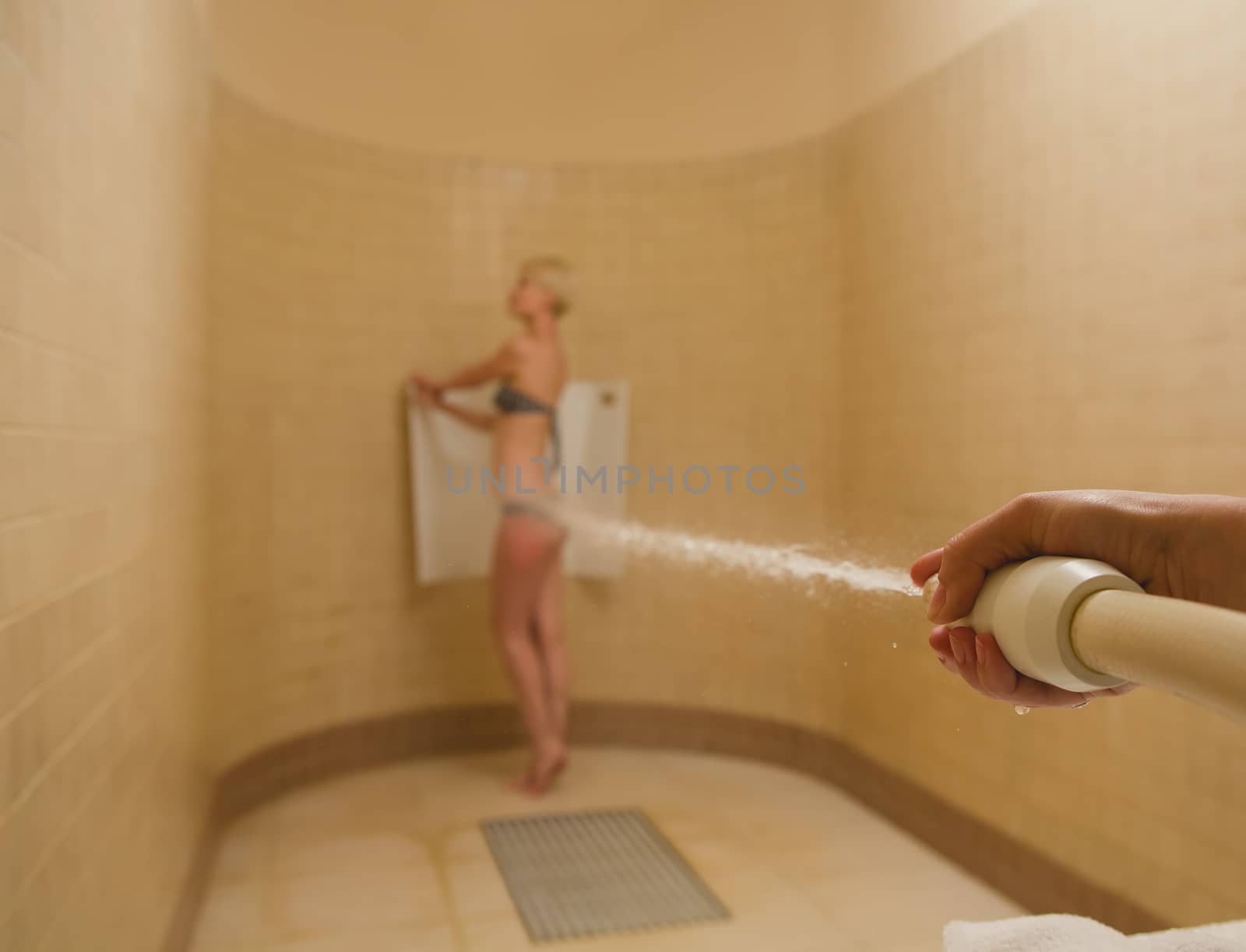 Woman having high pressure massage with Sharko shower by sarymsakov