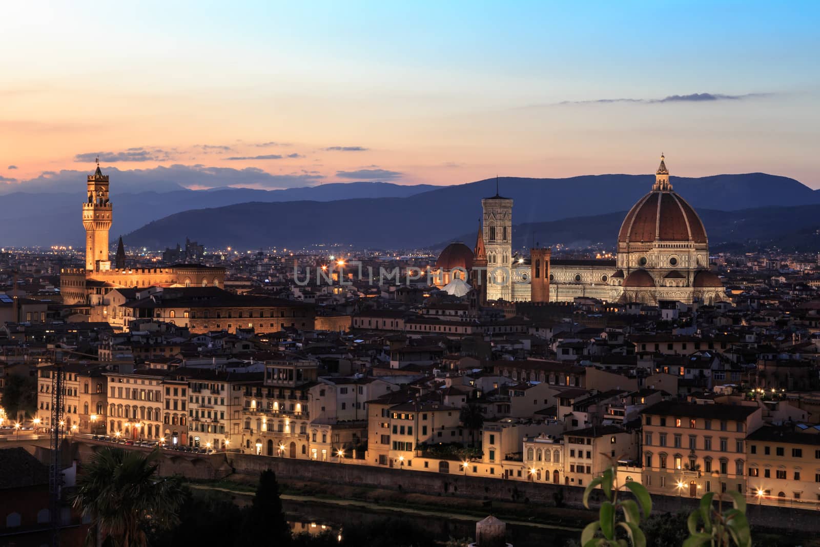 Top view of Florence city with old and historical buildings, on cloudy sunrise or sunset sky background.