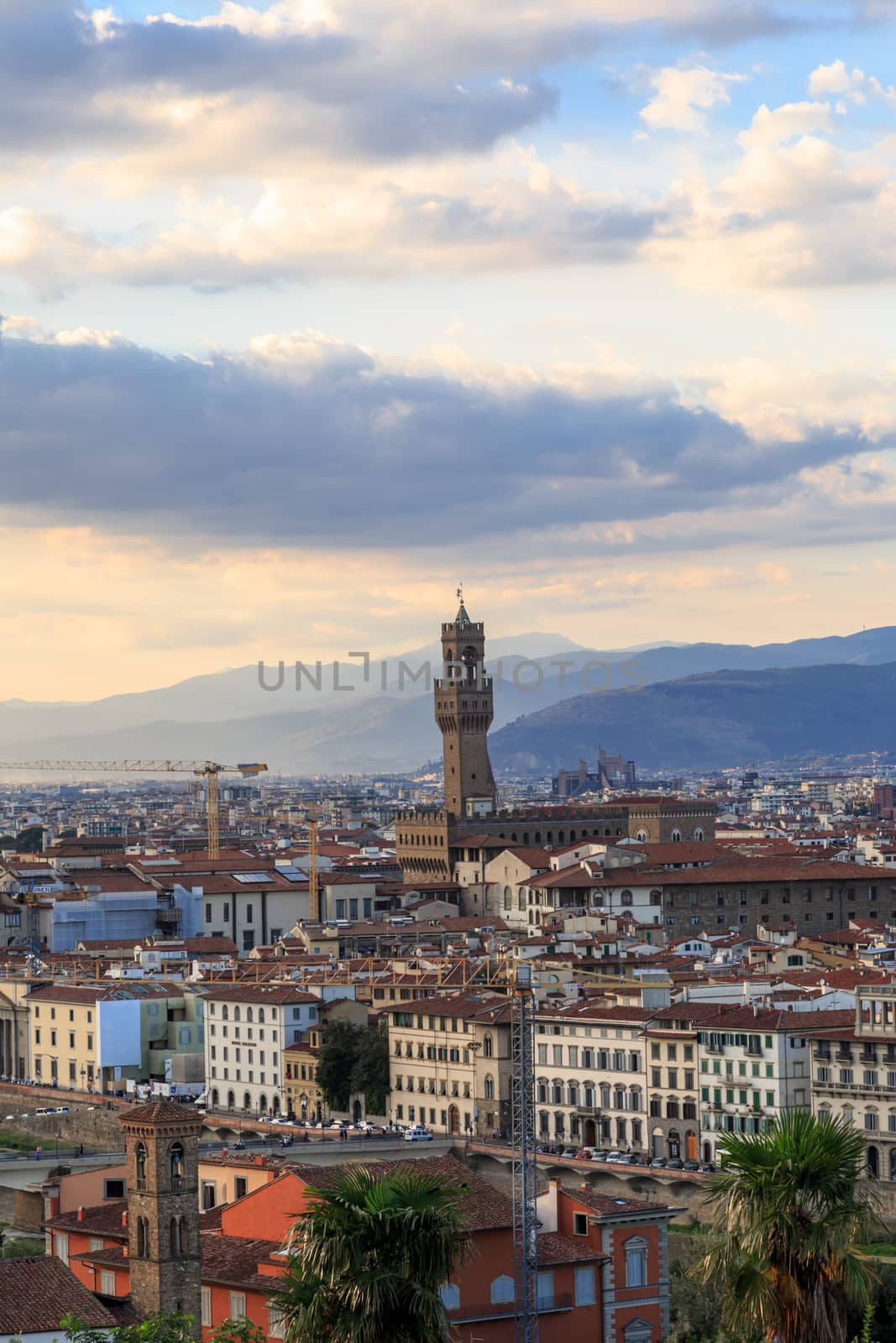 Top view of Florence city with old and historical buildings, on cloudy sunrise or sunset sky background.