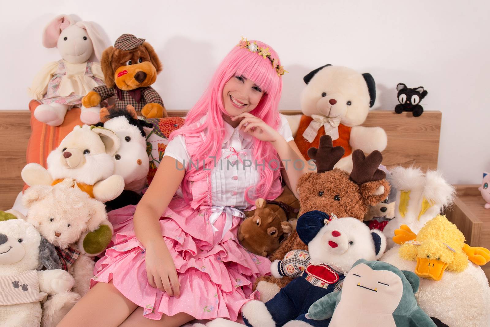 young girl in a bedroom in a pink cute dress by membio