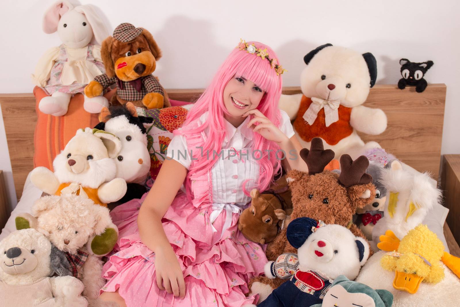 young girl in a bedroom in a pink cute dress by membio