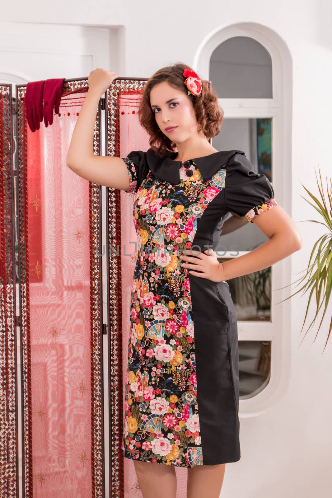 View of a young girl with a japanese style dress in her home