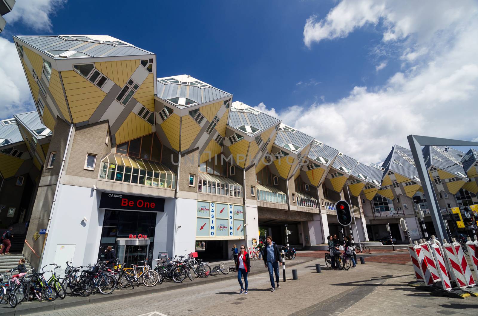 Rotterdam, Netherlands - May 9, 2015: People around Cube Houses the iconic in Rotterdam. Cube Houses are a set of innovative houses built in Rotterdam and Helmond in the Netherlands, designed by architect Piet Blom.