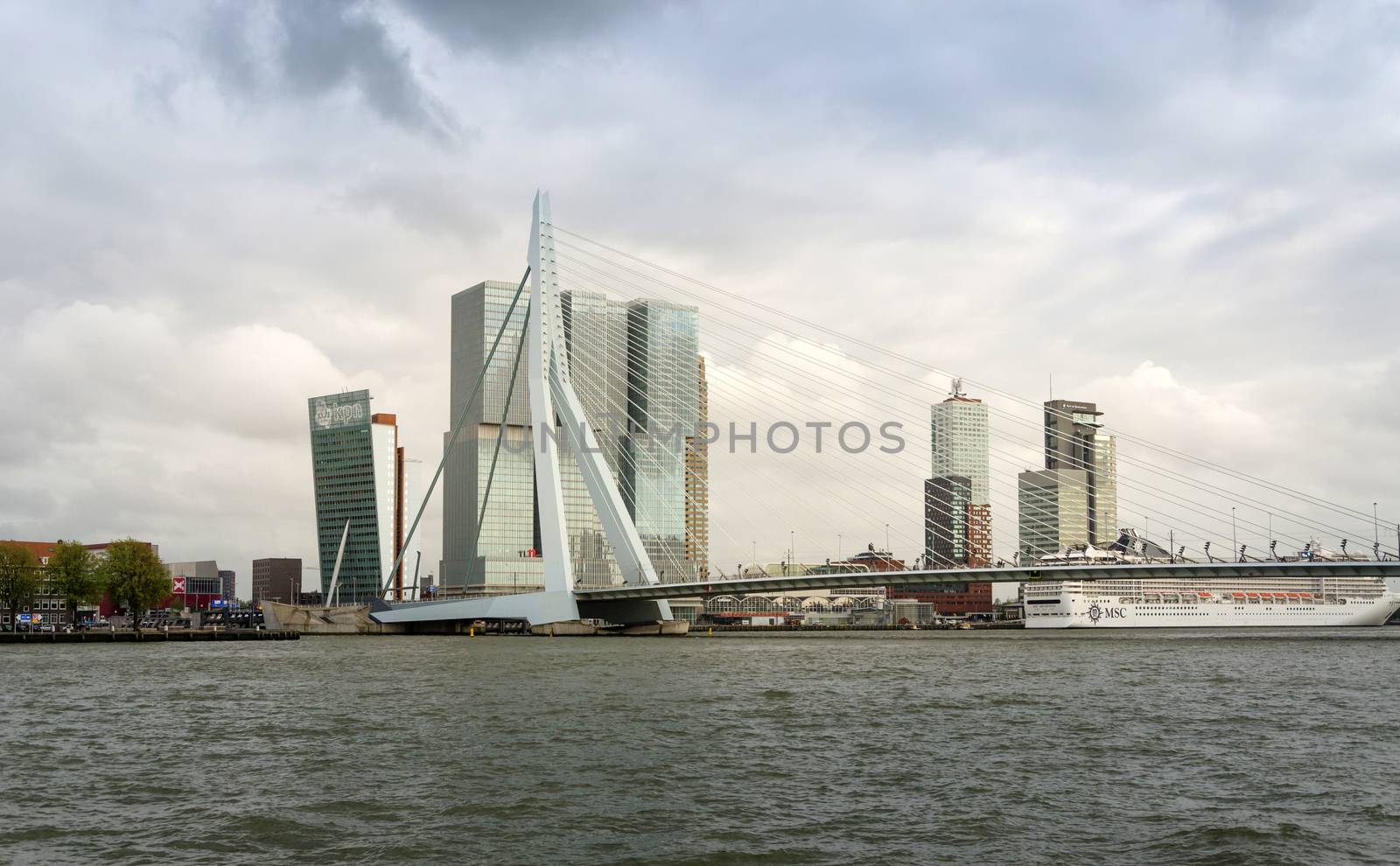 Rotterdam, Netherlands - May 9, 2015: Erasmus Bridge with Skyscraper in Rotterdam by siraanamwong