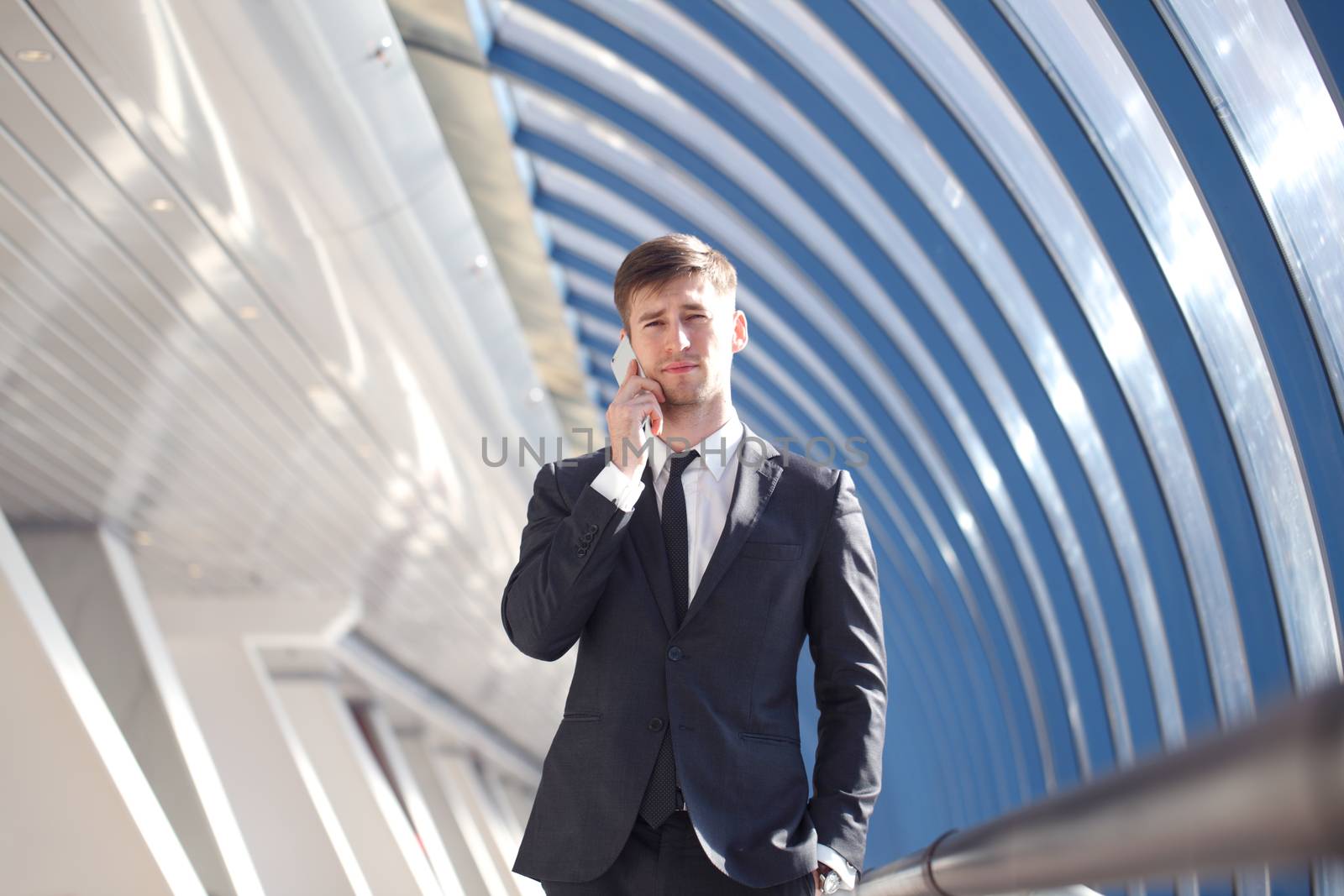 Businessman talking on the phone in modern building