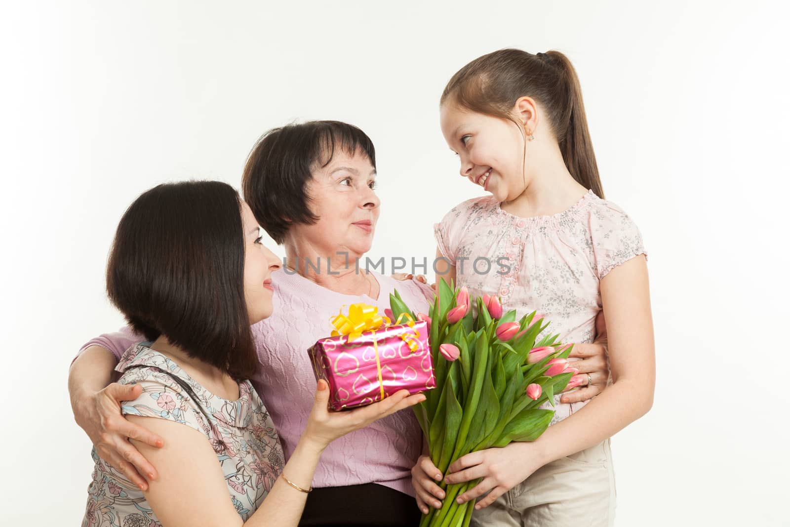 the daughter and the granddaughter give a bouquet by sveter