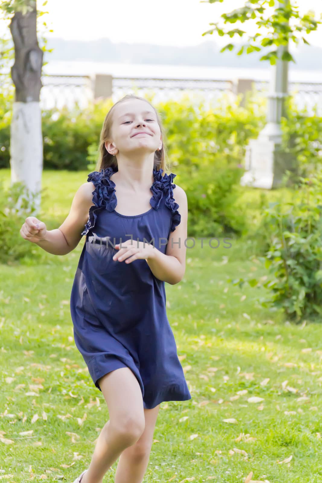 Caucasian cute girl with blond hair in park