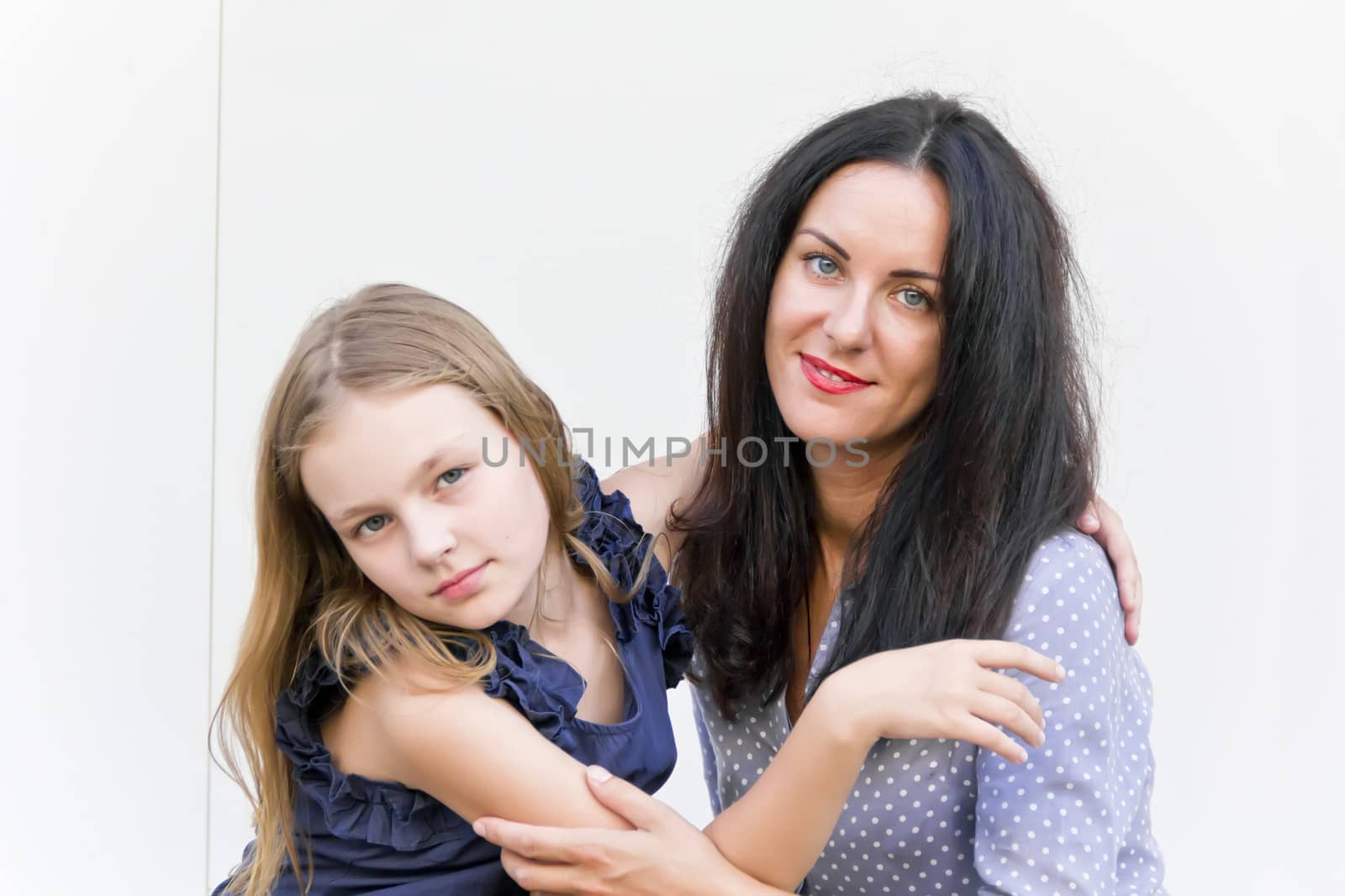 Portrait of mother and daughter on white