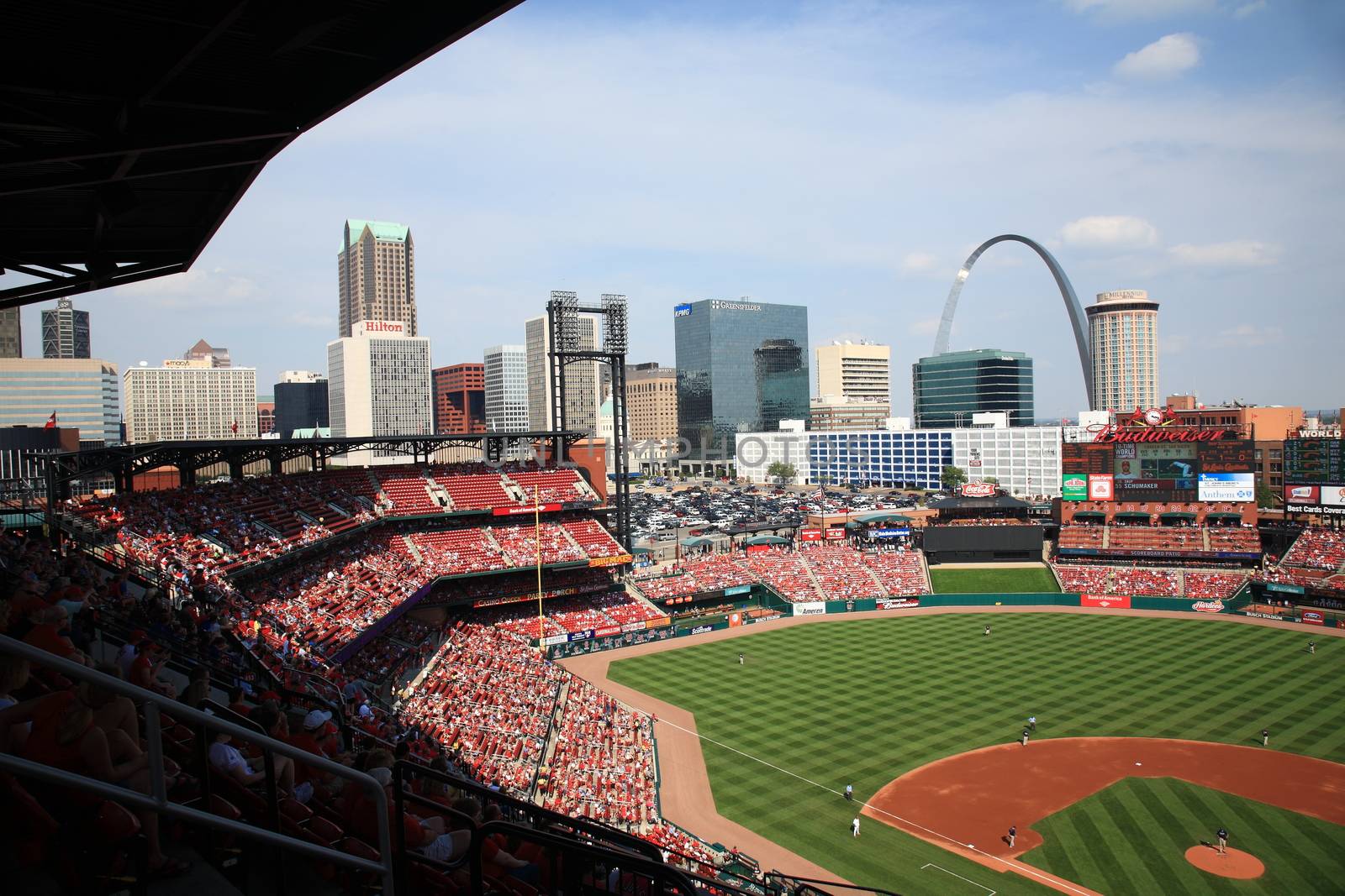 The Gateway Arch towers over a Cardinals game at Busch Stadium in St. Louis.