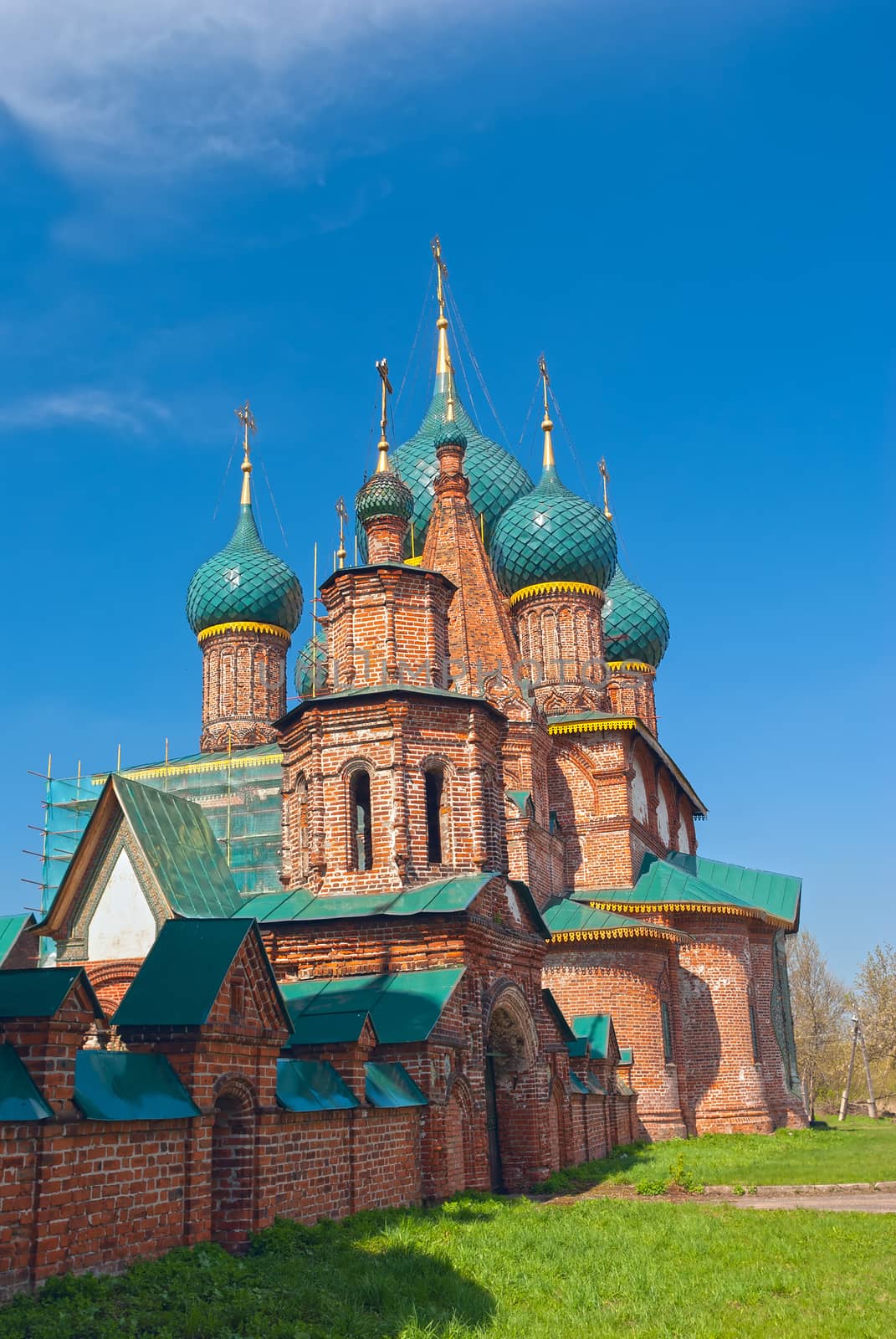 Ancient repairing church of red brick in summer day by BIG_TAU