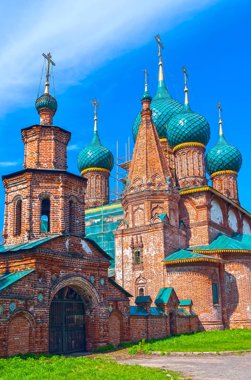 Ancient repairing church of red brick in summer sunny day