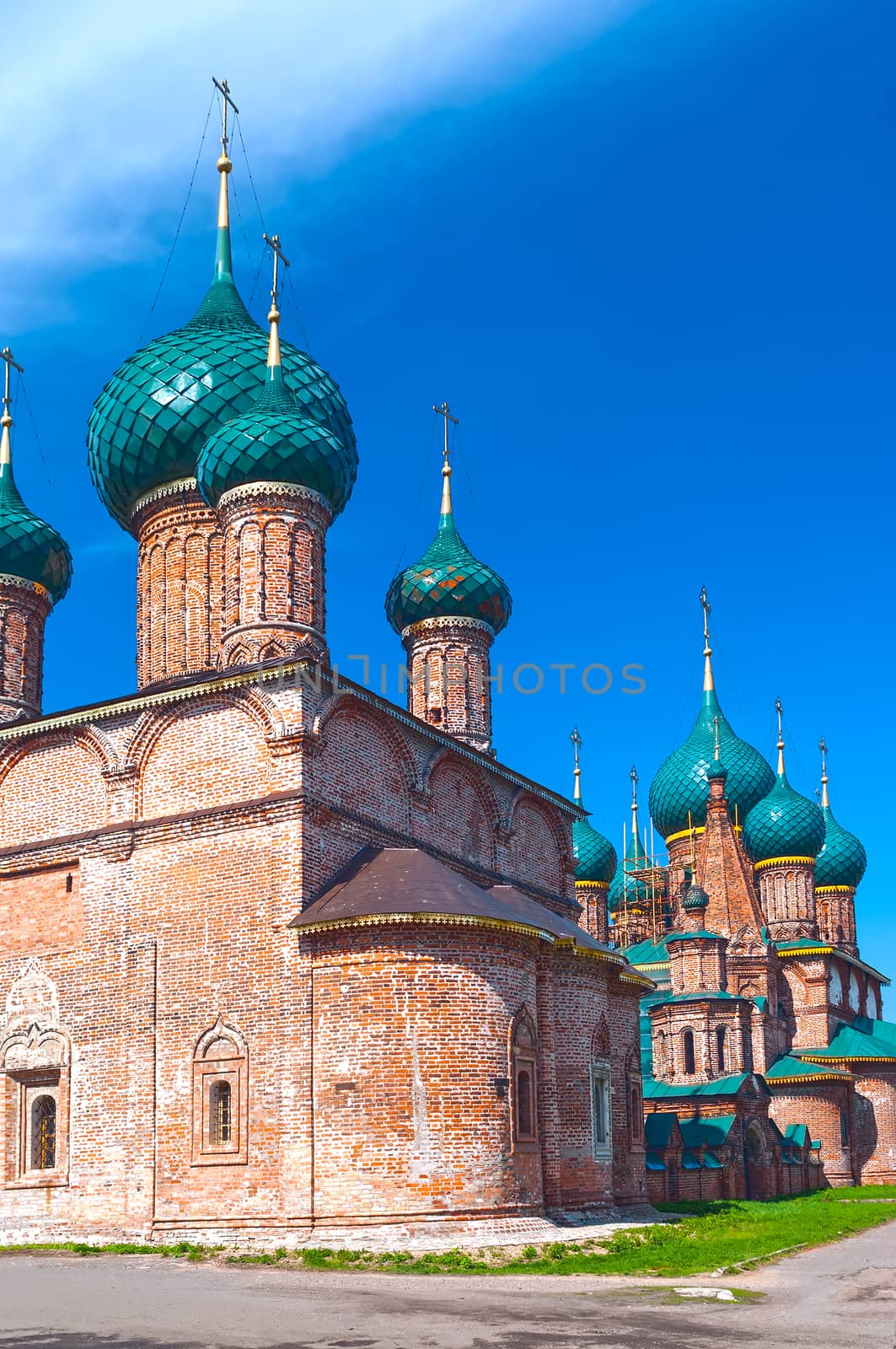 Ancient repairing church of red brick in summer sunny day