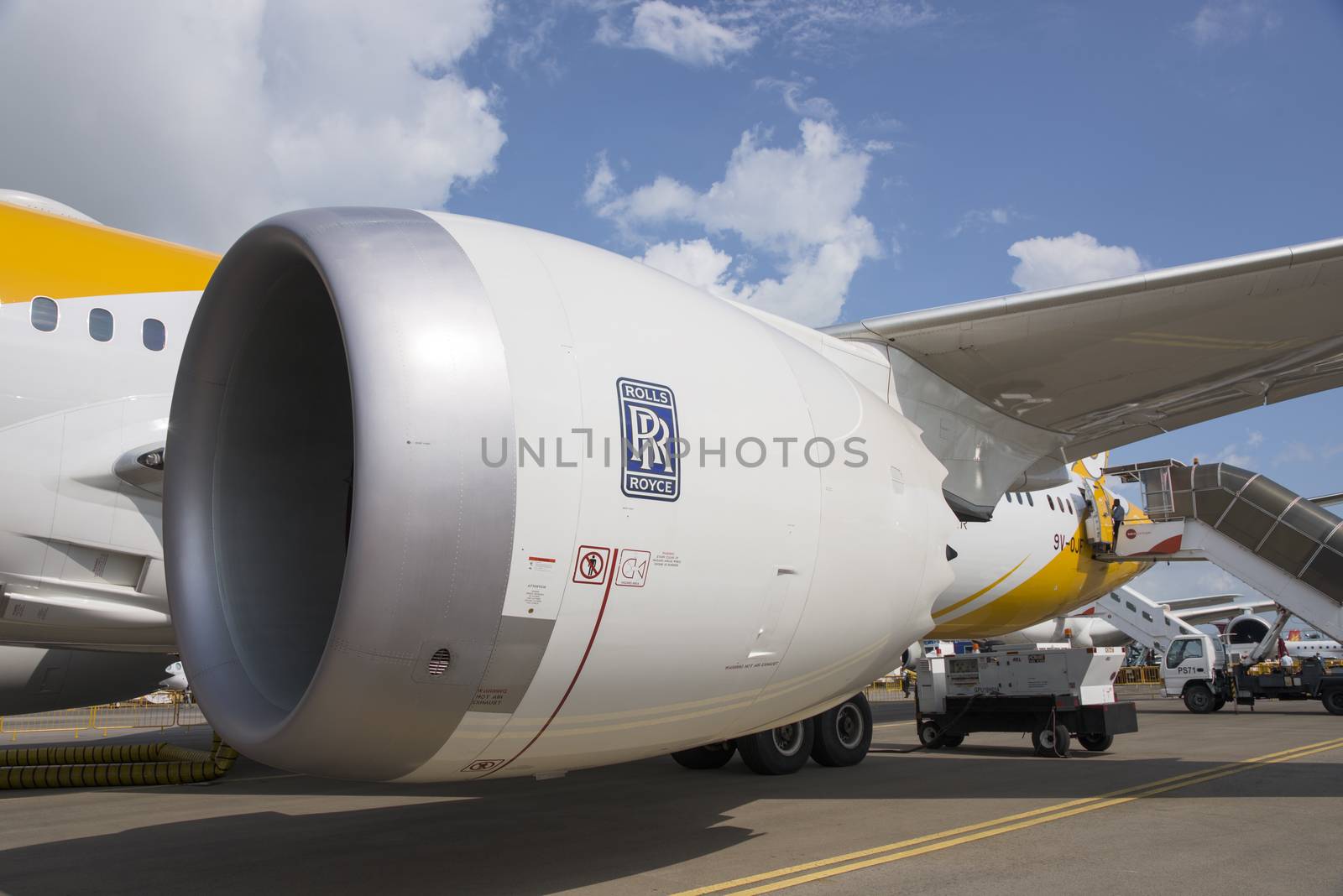Singapore - February 16, 2016: The Rolls-Royce Trent 1000 engine of a Boeing 787-9 Dreamliner in the livery of no frills Singapore airline Scoot during Singapore Airshow at Changi Exhibition Centre in Singapore.