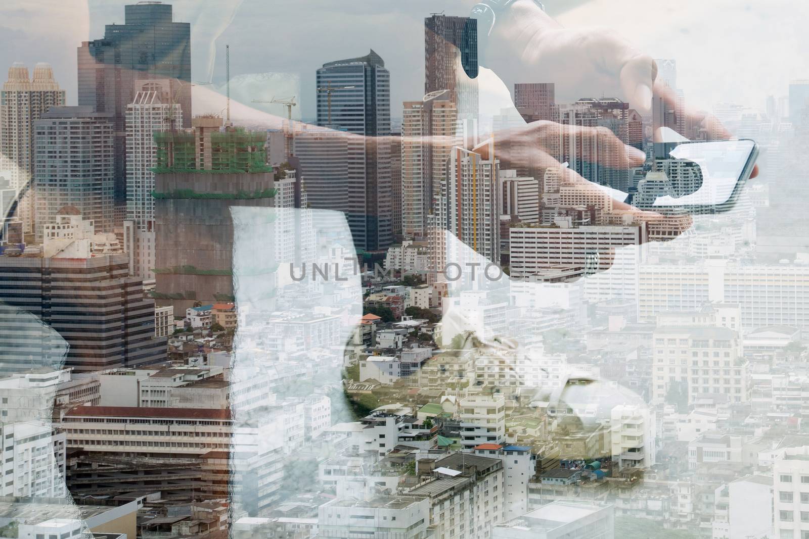 Double exposure image of people with smart phone and cityscape,communication technology concept