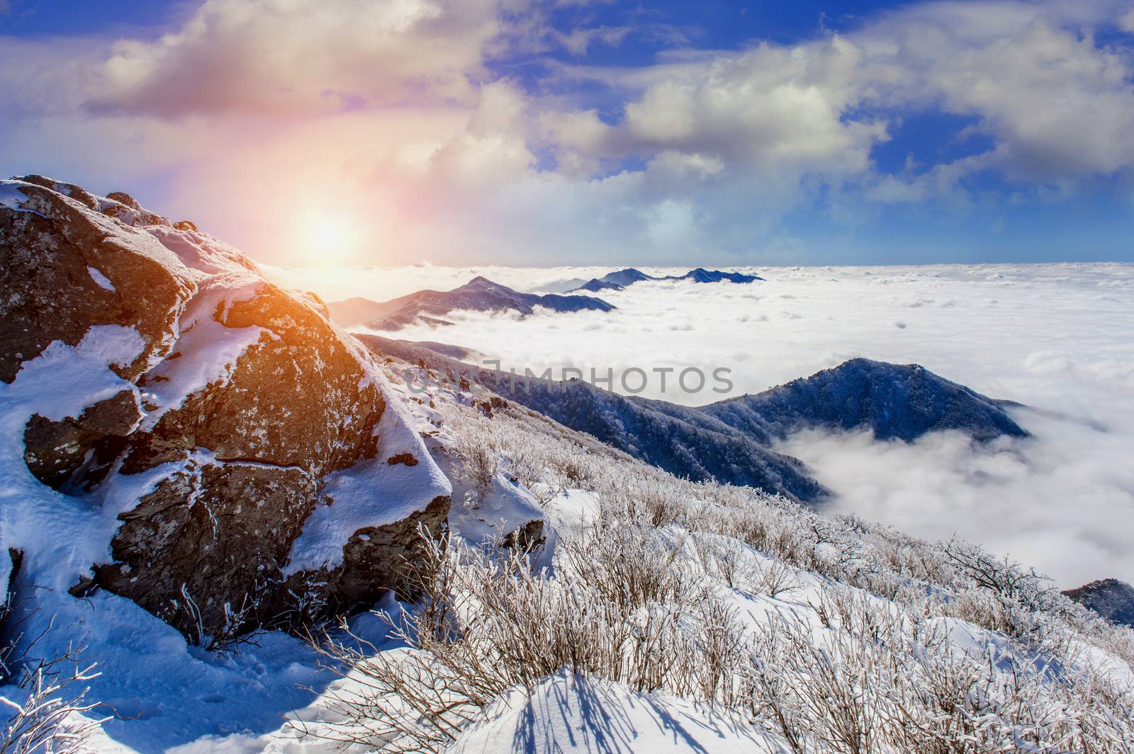 Seoraksan mountains is covered by morning fog and sunlight in wi by gutarphotoghaphy