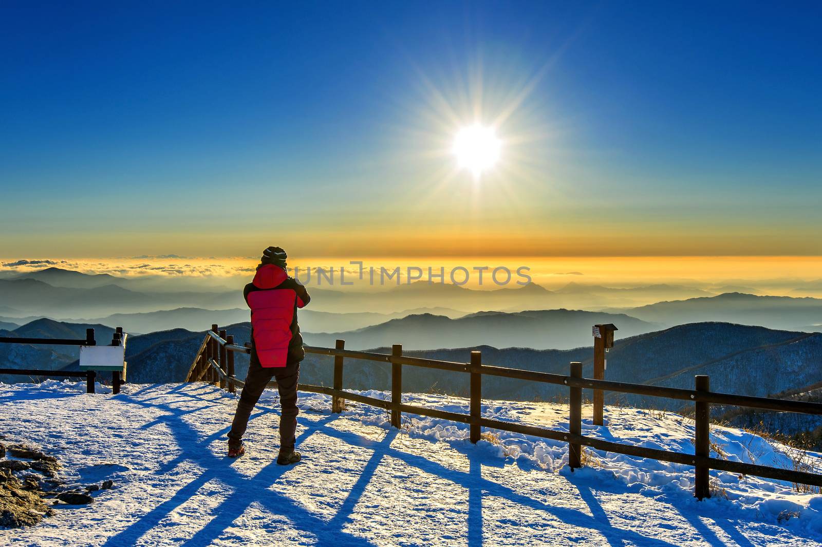 Mountaineer stands on the peak in Winter,Deogyusan national park by gutarphotoghaphy