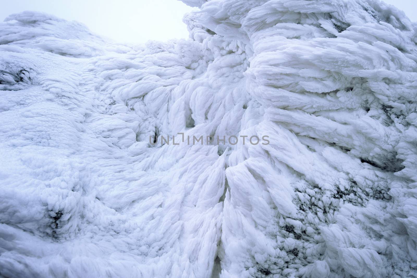 Wind painted Snow Texture Pattern on stone Background, Winter background.