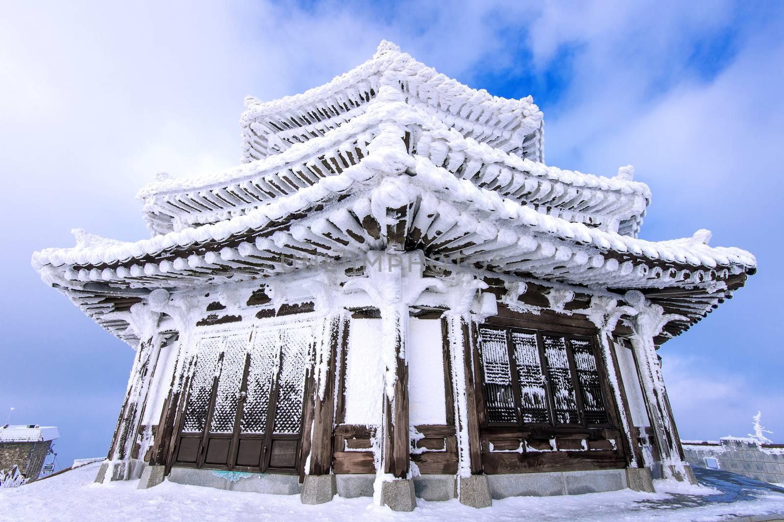 Wooden house is covered by snow in winter, Deogyusan mountains South Korea.