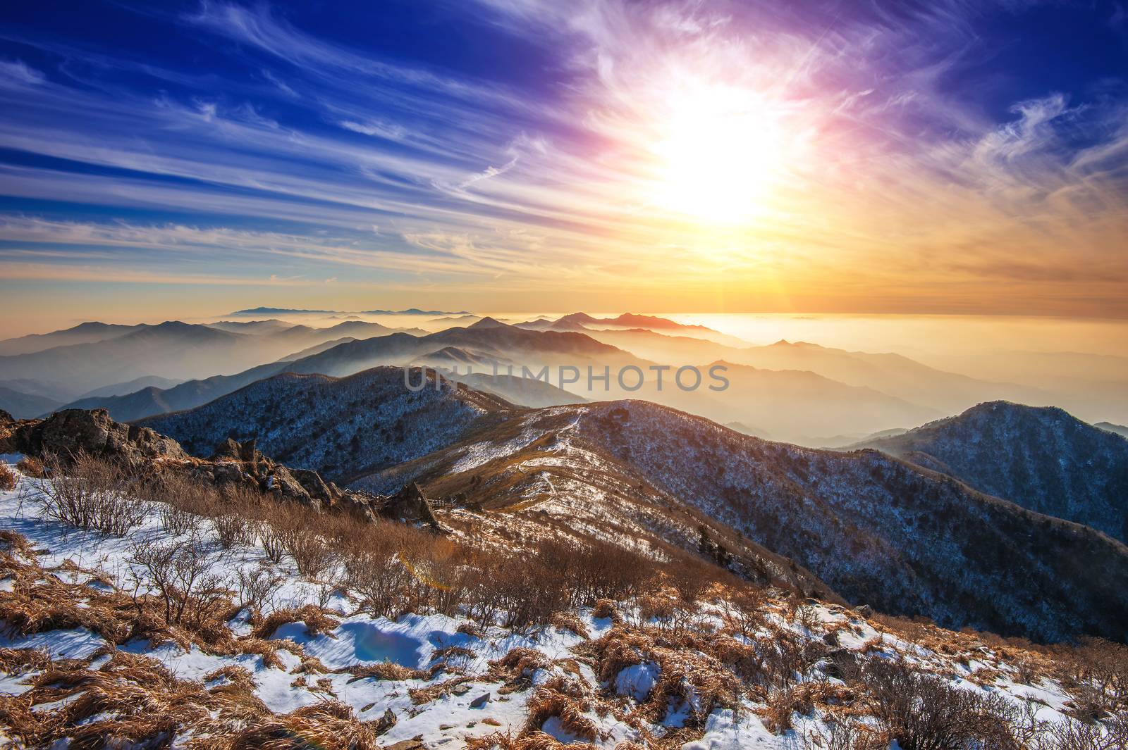 Winter landscape with sunset and foggy in Deogyusan mountains, South Korea.