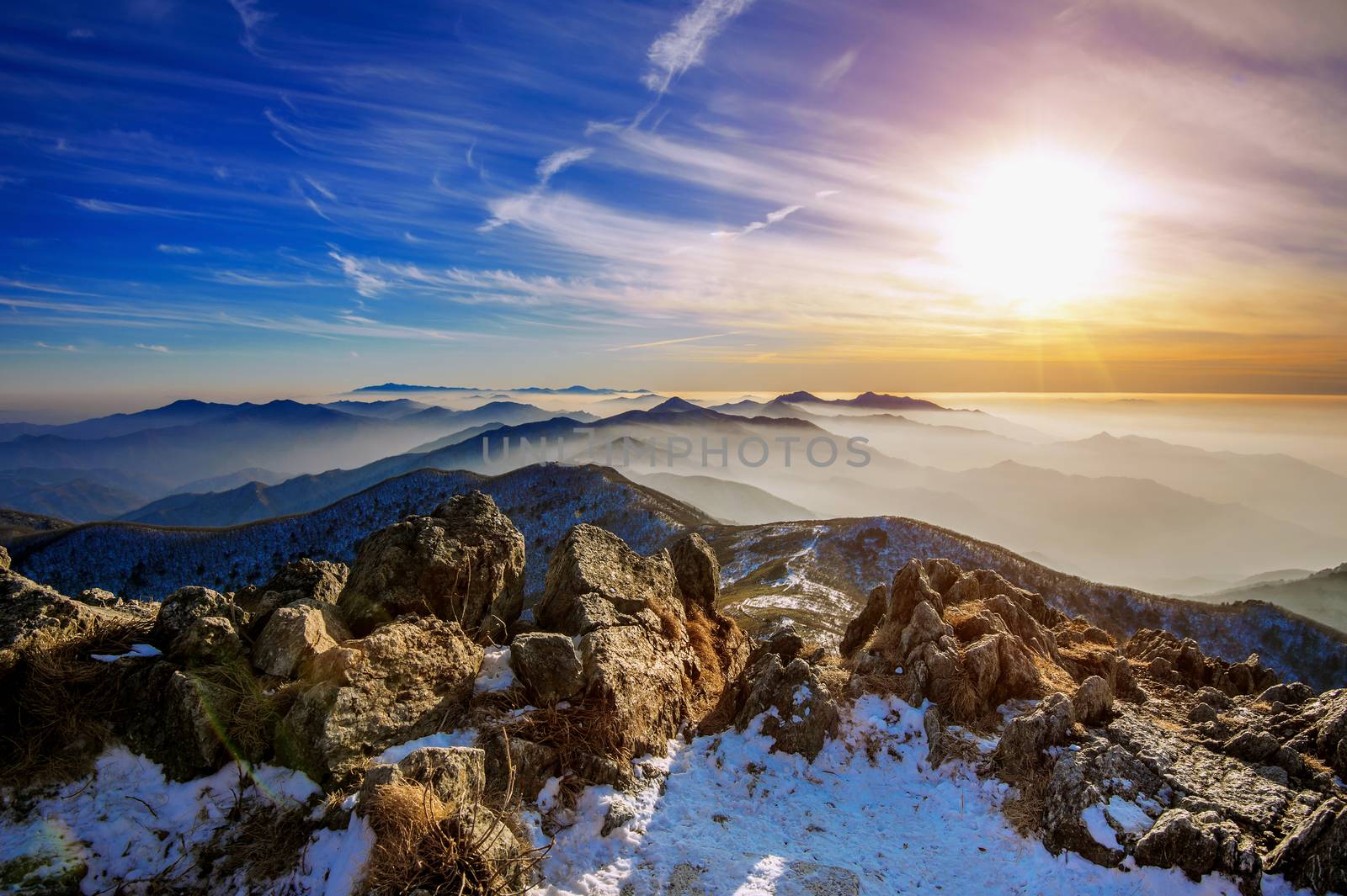 Winter landscape with sunset and foggy in Deogyusan mountains, South Korea. by gutarphotoghaphy