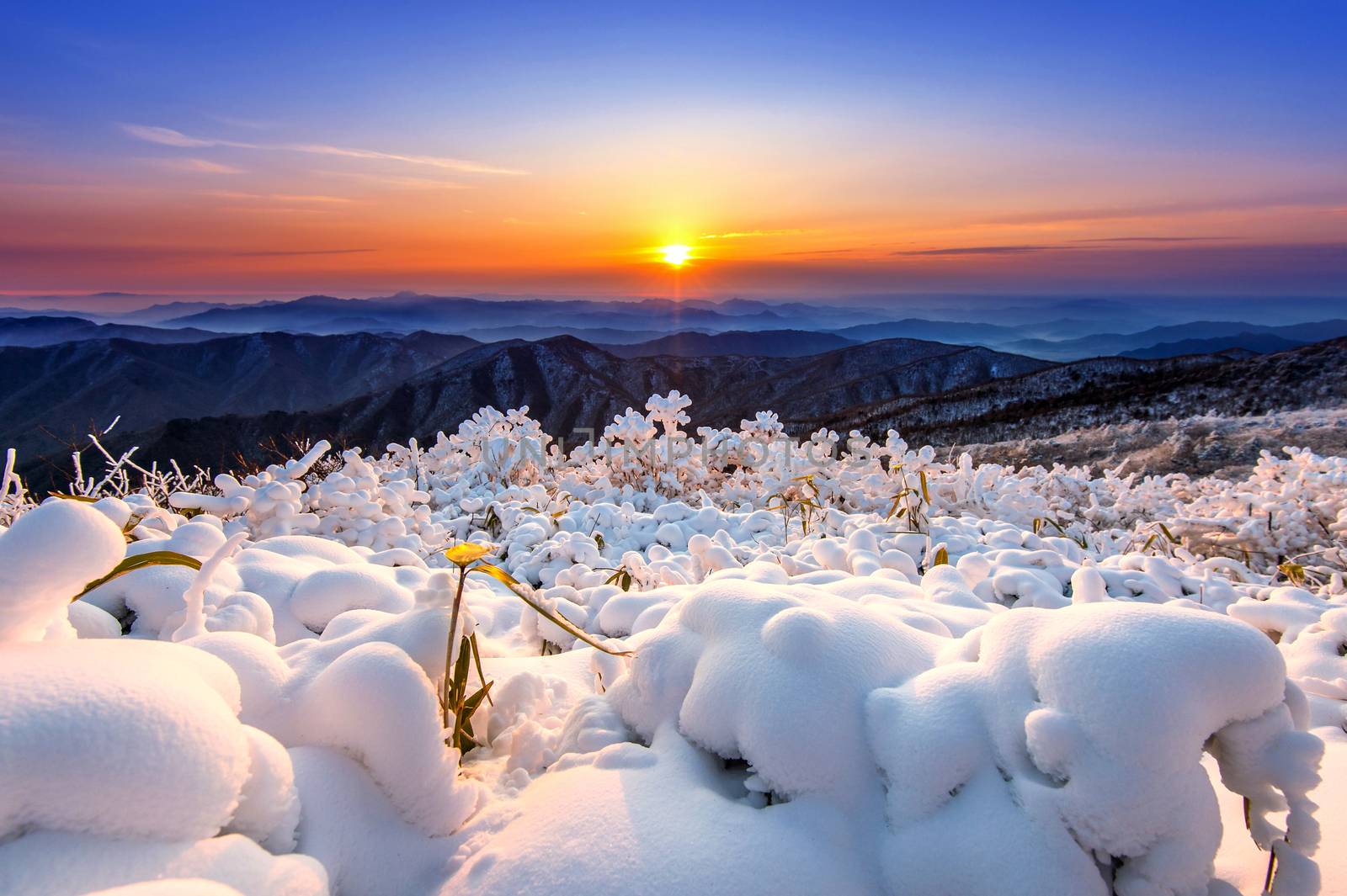 Beautiful sunrise on Deogyusan mountains covered with snow in winter,South Korea.