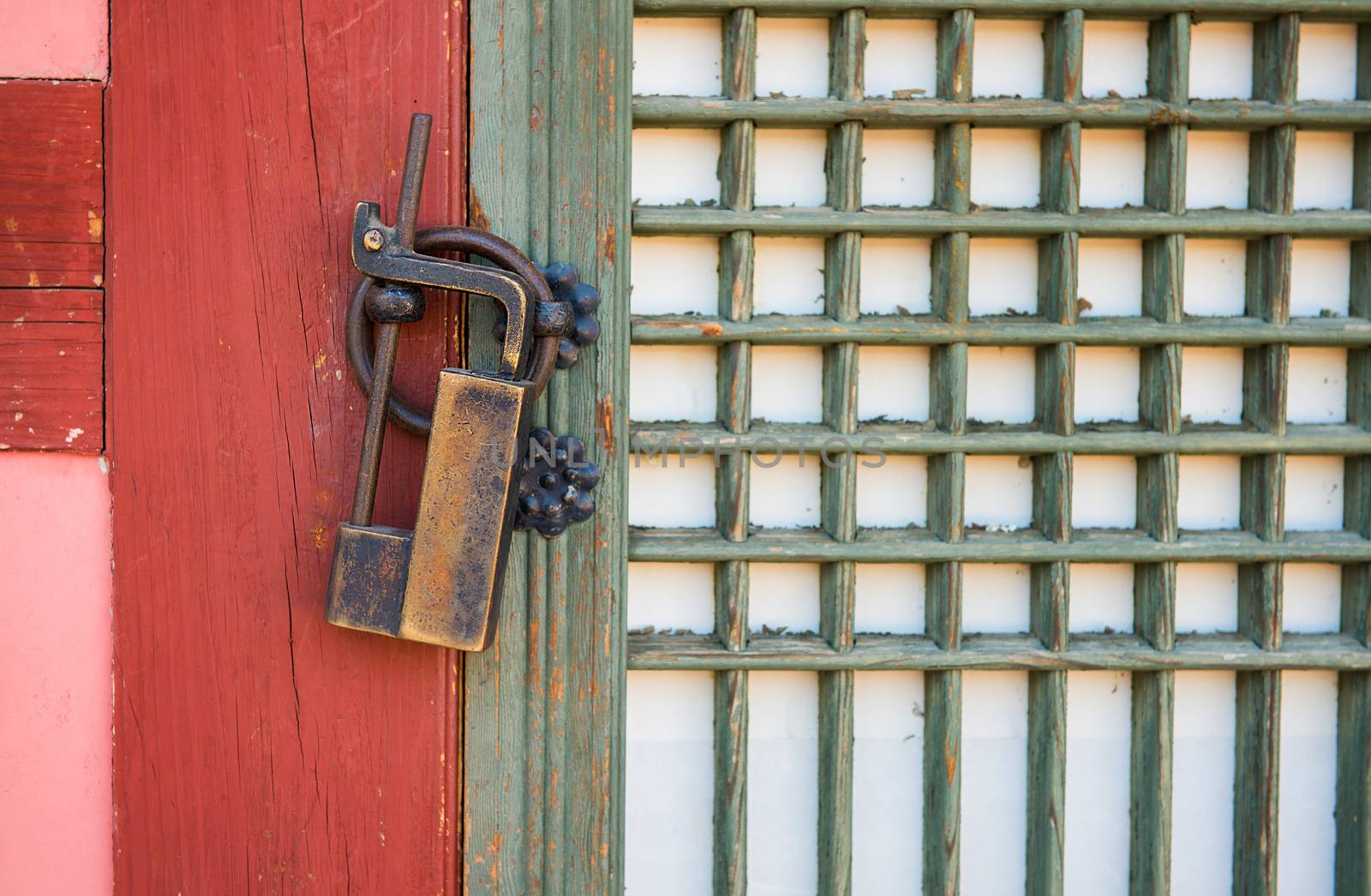 Old rusty lock on the wooden gate by gutarphotoghaphy