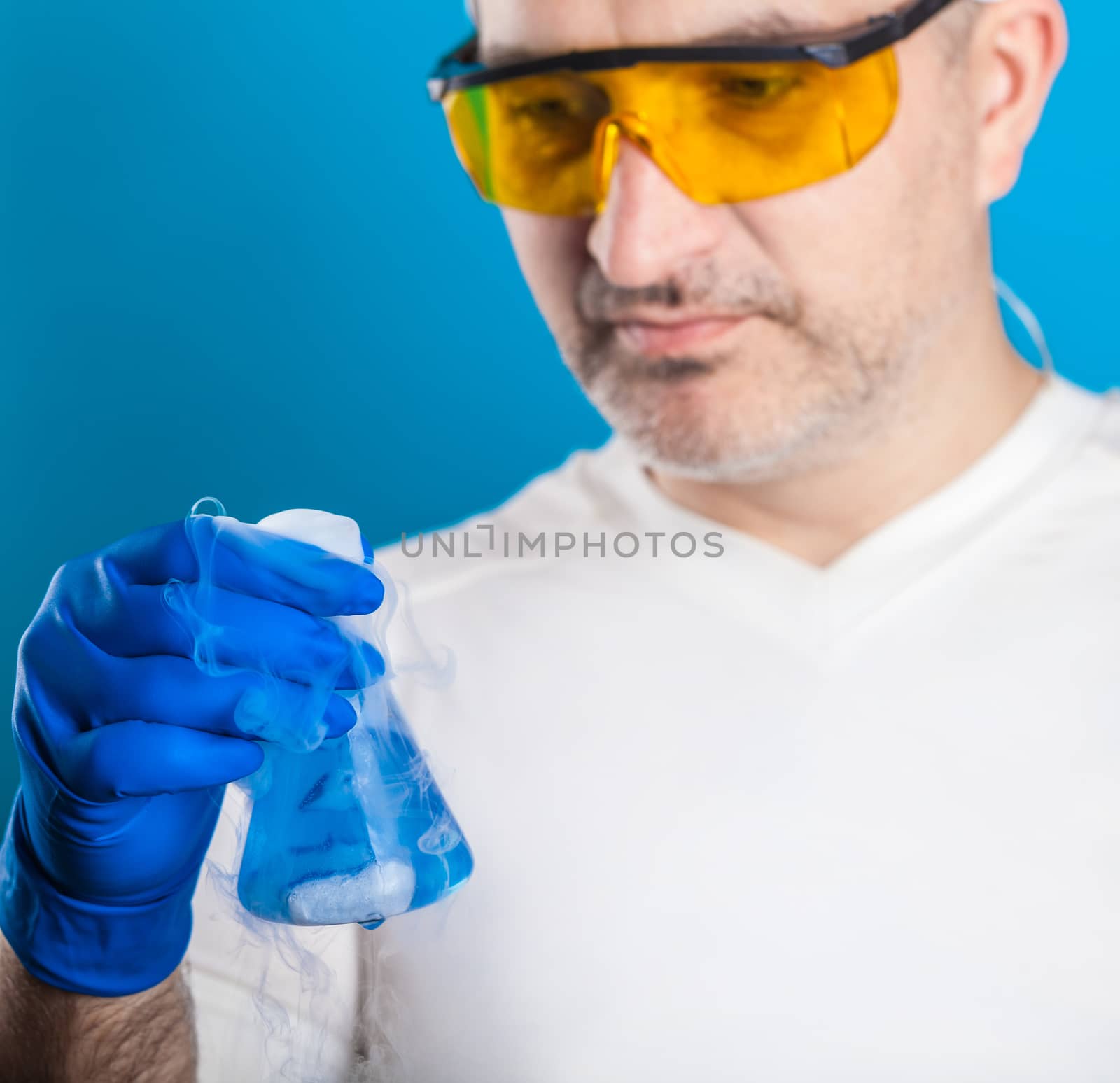 man chemist examines test tube  by MegaArt
