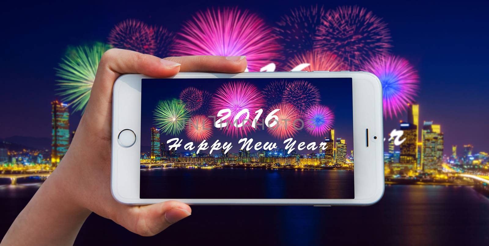 Hand holding smart phone take a photo at happy new year 2016 and Firework dishplay.