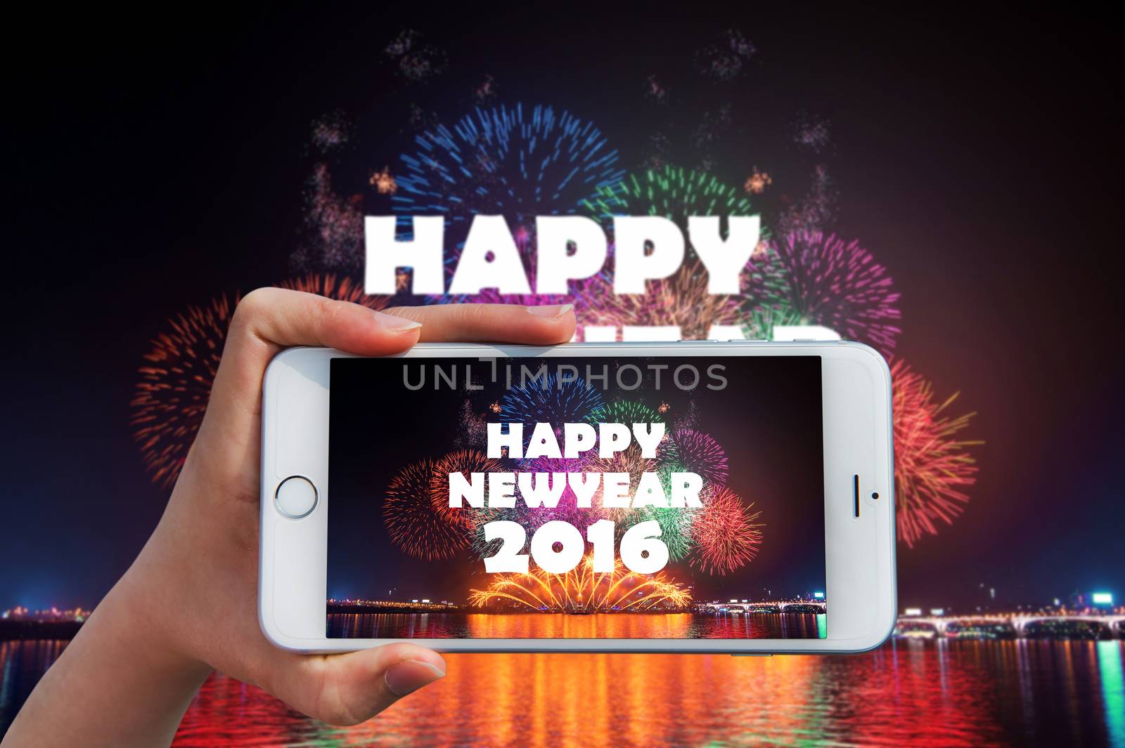 Hand holding smart phone take a photo at happy new year 2016 and by gutarphotoghaphy