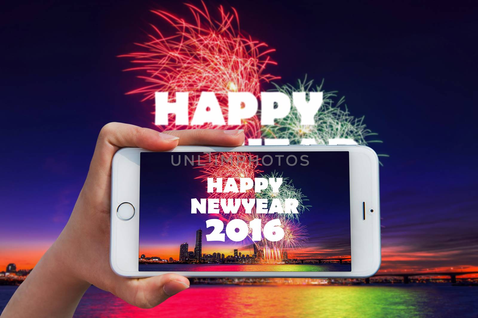 Hand holding smart phone take a photo at happy new year 2016 and by gutarphotoghaphy