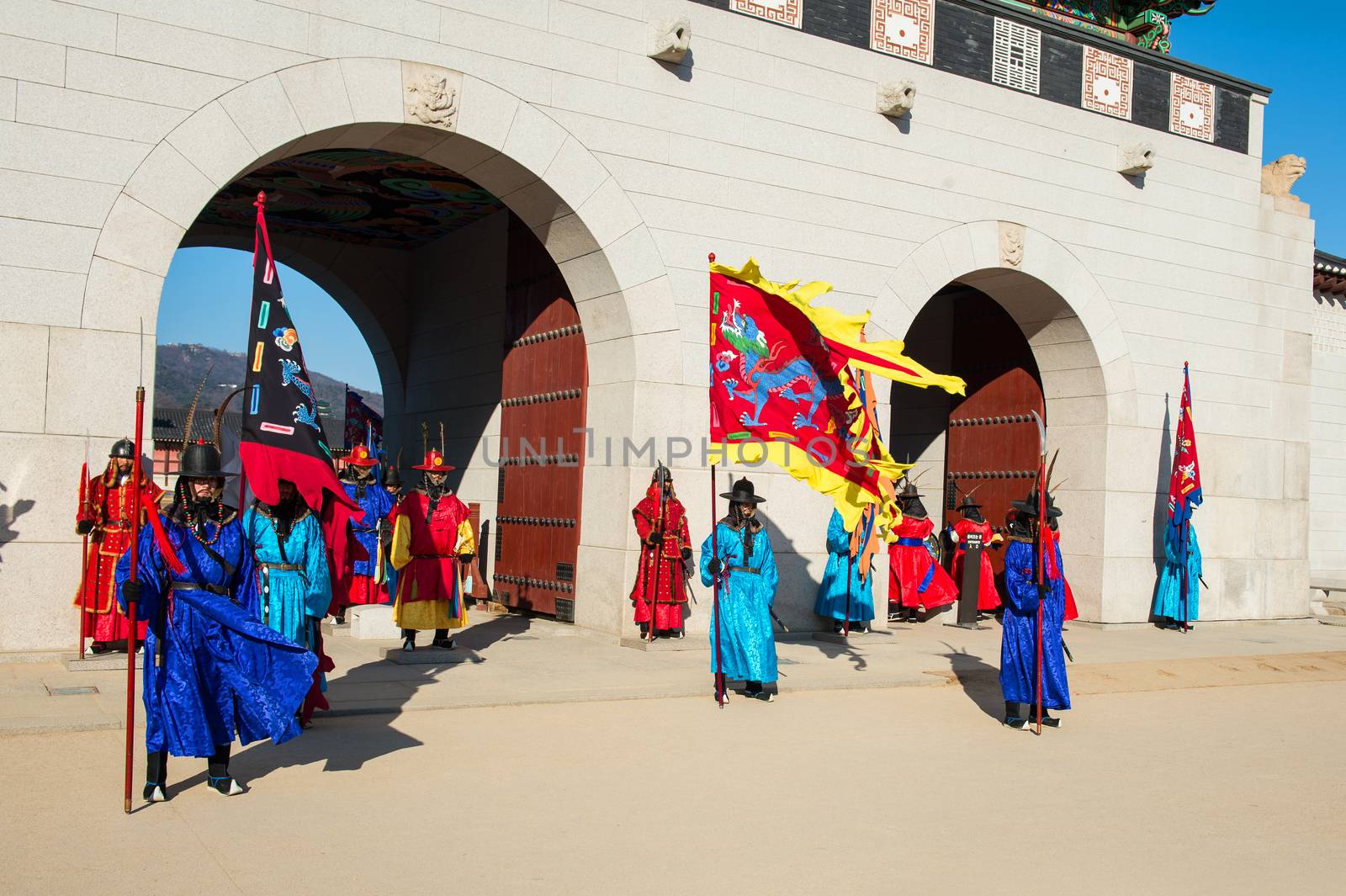 Soldier with traditional Joseon dynasty uniform guards the Gyeongbokgung Palace. by gutarphotoghaphy