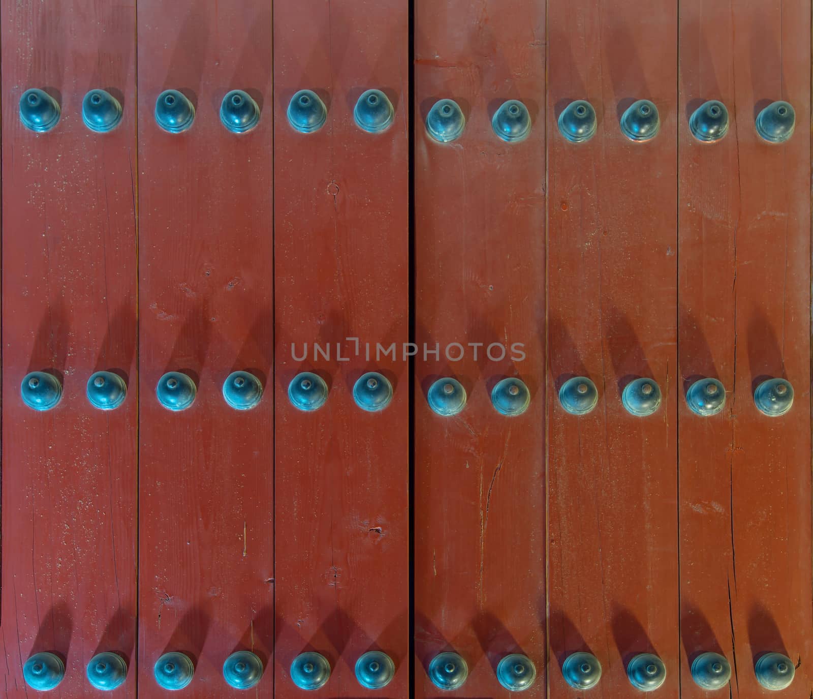 Wooden door of Geyongbokgung Palace at night in Seoul, South Korea.