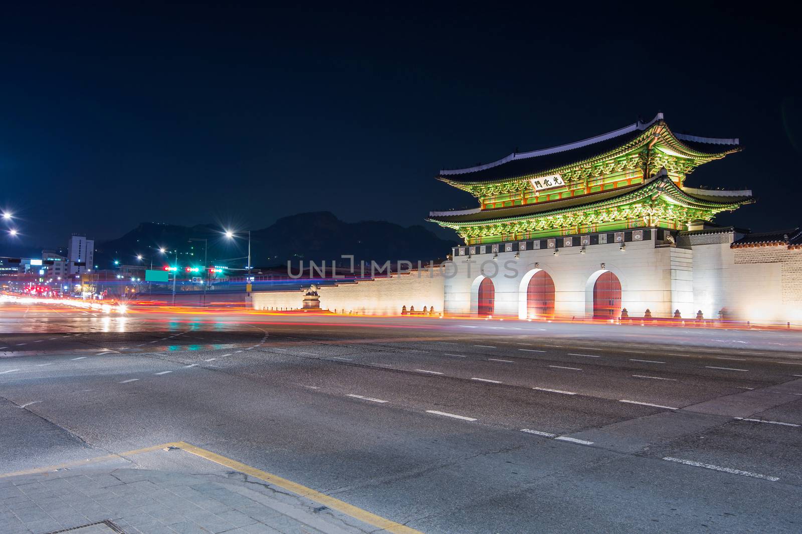 Geyongbokgung Palace and car light at night in Seoul, South Kore by gutarphotoghaphy