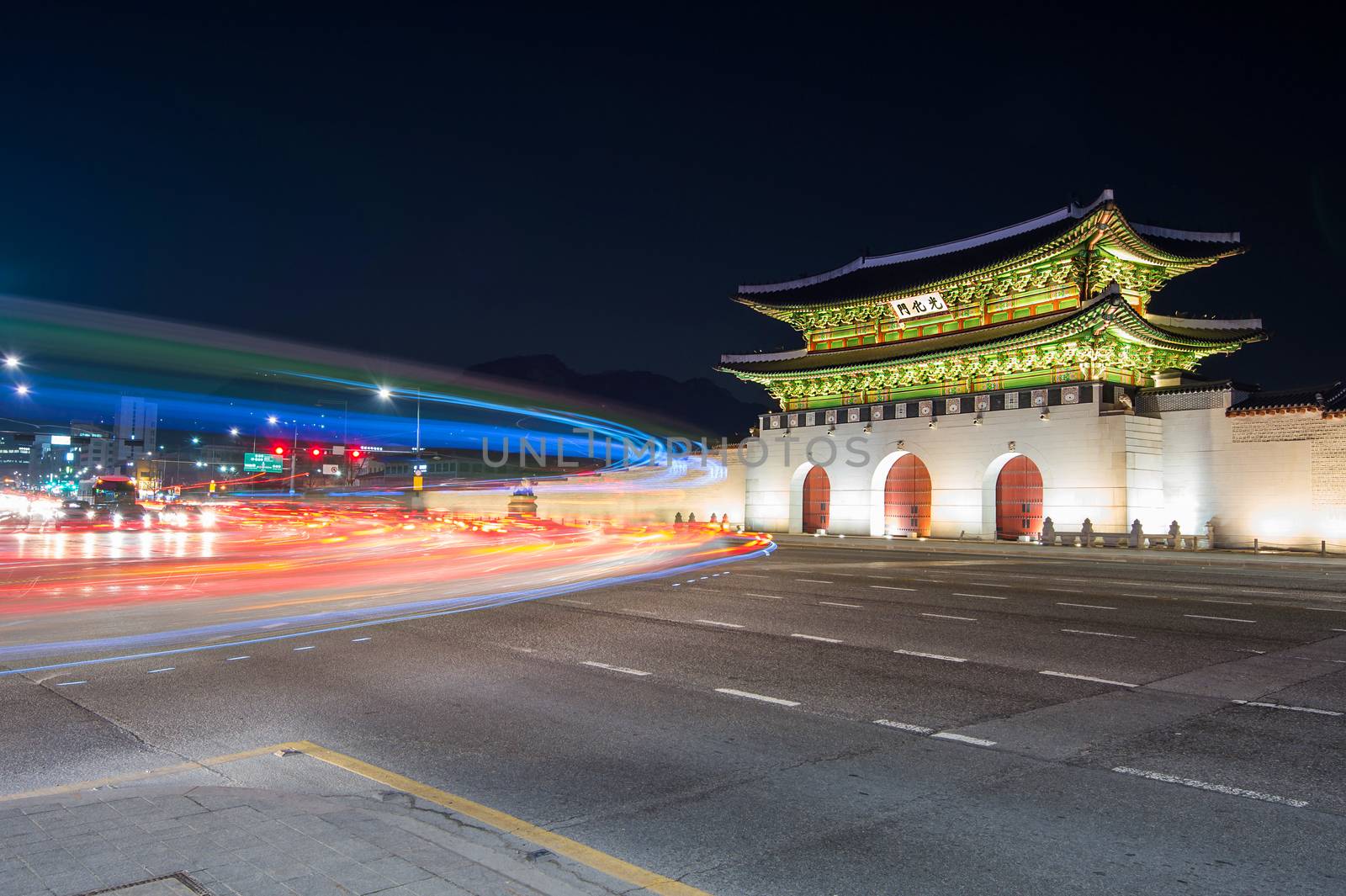 Geyongbokgung Palace and car light at night in Seoul, South Korea.