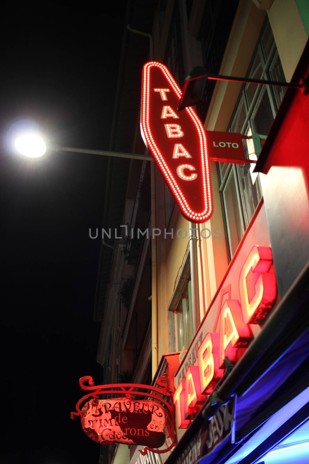 Nice, France - February 15 2016: French Red and White Tabac Sign on a Wall of a Tobacconist. Tabac meaning Tobacco in French