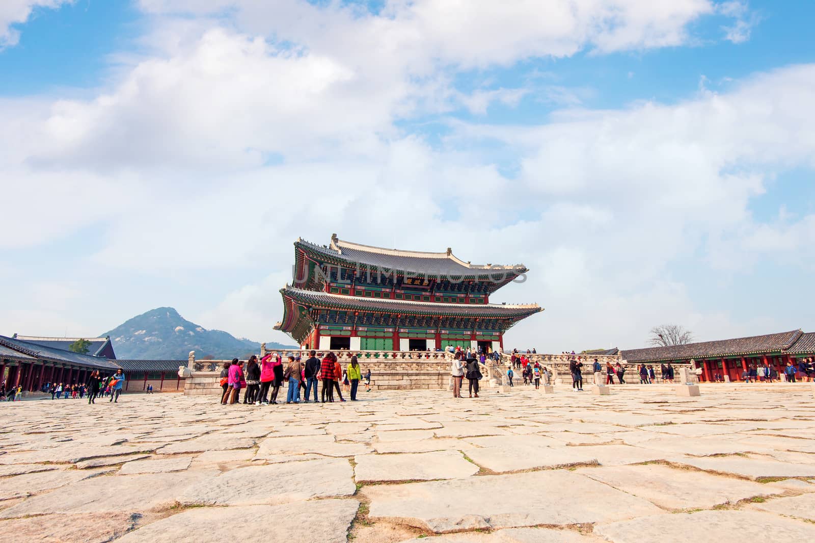 SEOUL, SOUTH KOREA - APRIL 9: Tourists taking photos of the beautiful scenery around Gyeongbokgung Palace on April 9, 2015 in Seoul, South Korea.