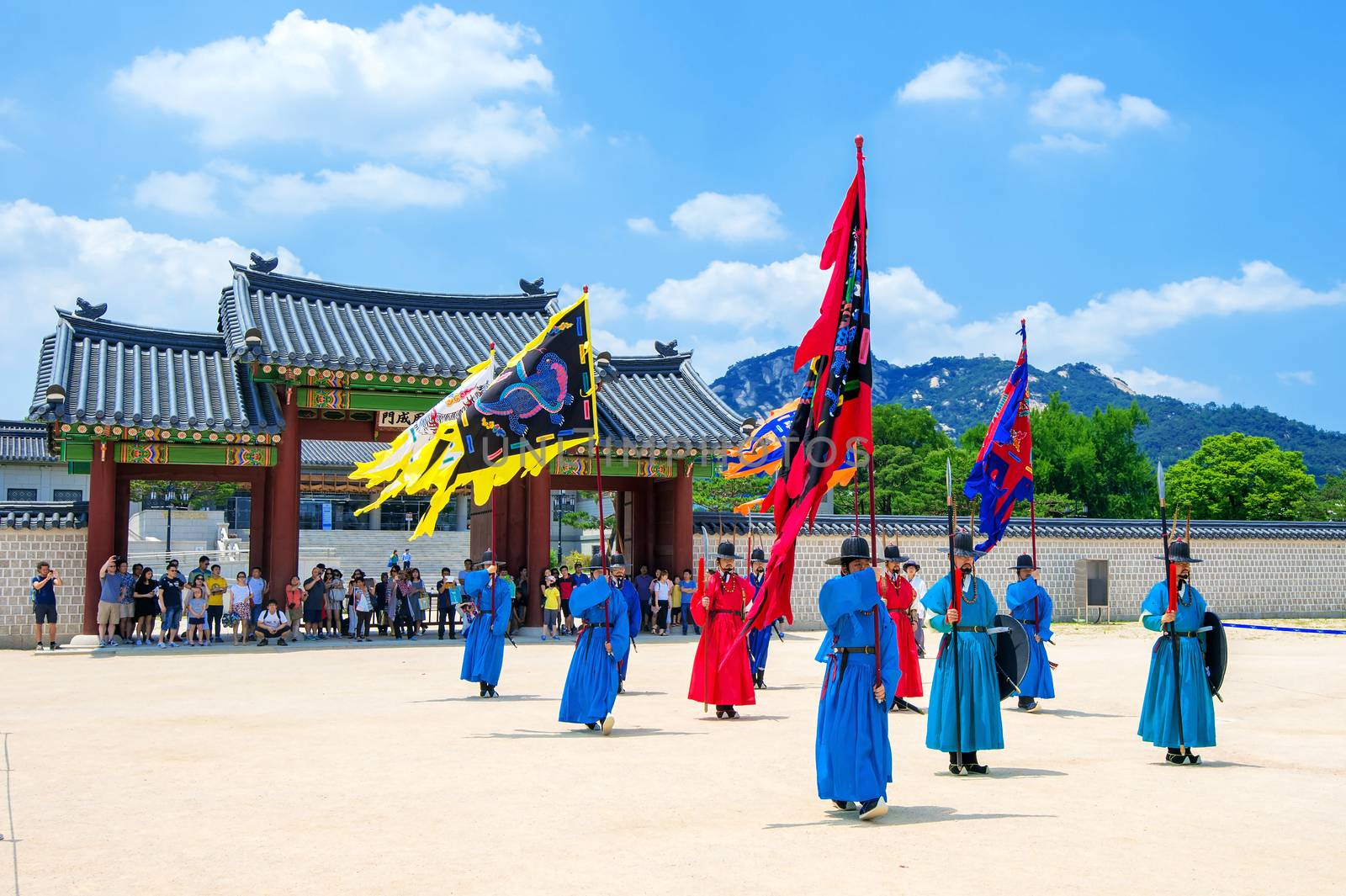 Soldier with traditional Joseon dynasty uniform guards the Gyeongbokgung Palace. by gutarphotoghaphy