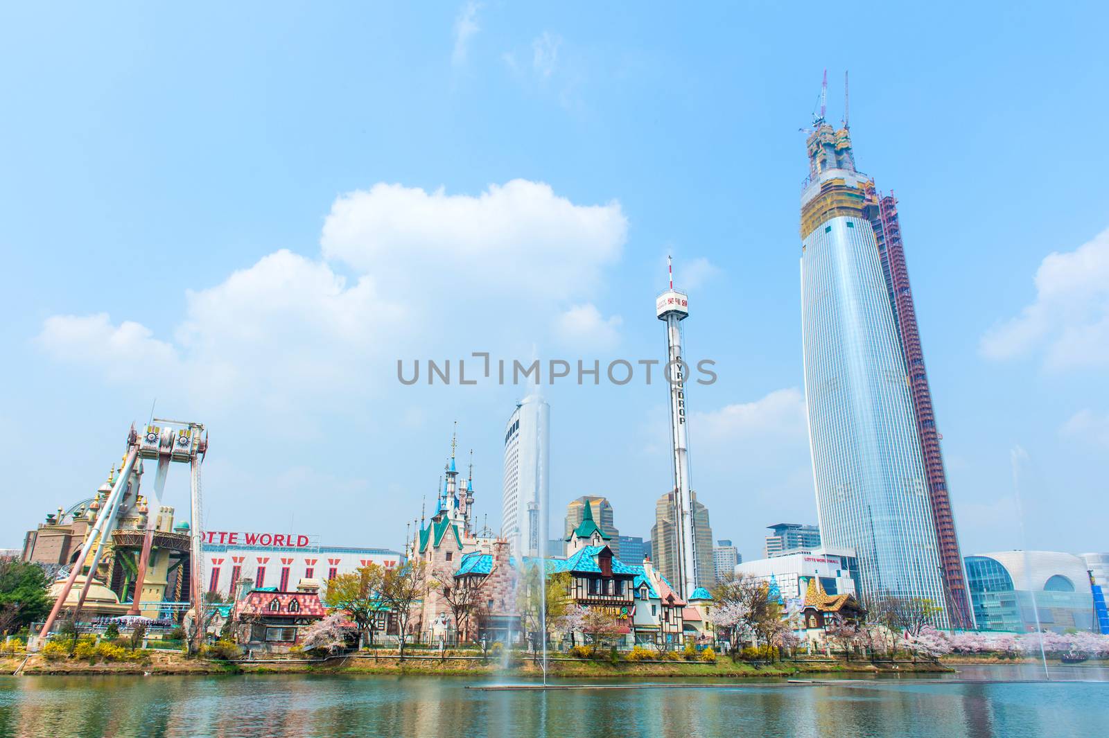 SEOUL, KOREA - APRIL 9, 2015: Lotte World amusement park and cherry blossom of Spring, a major tourist attraction in Seoul, South Korea on April 9, 2015