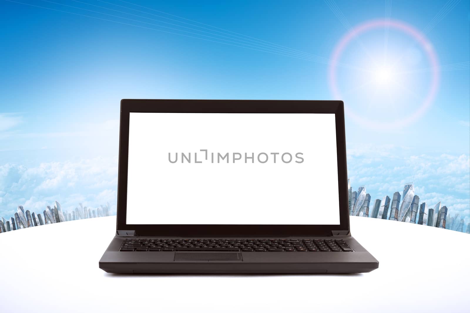 Laptop with blank screen and cityscape background, internet concept