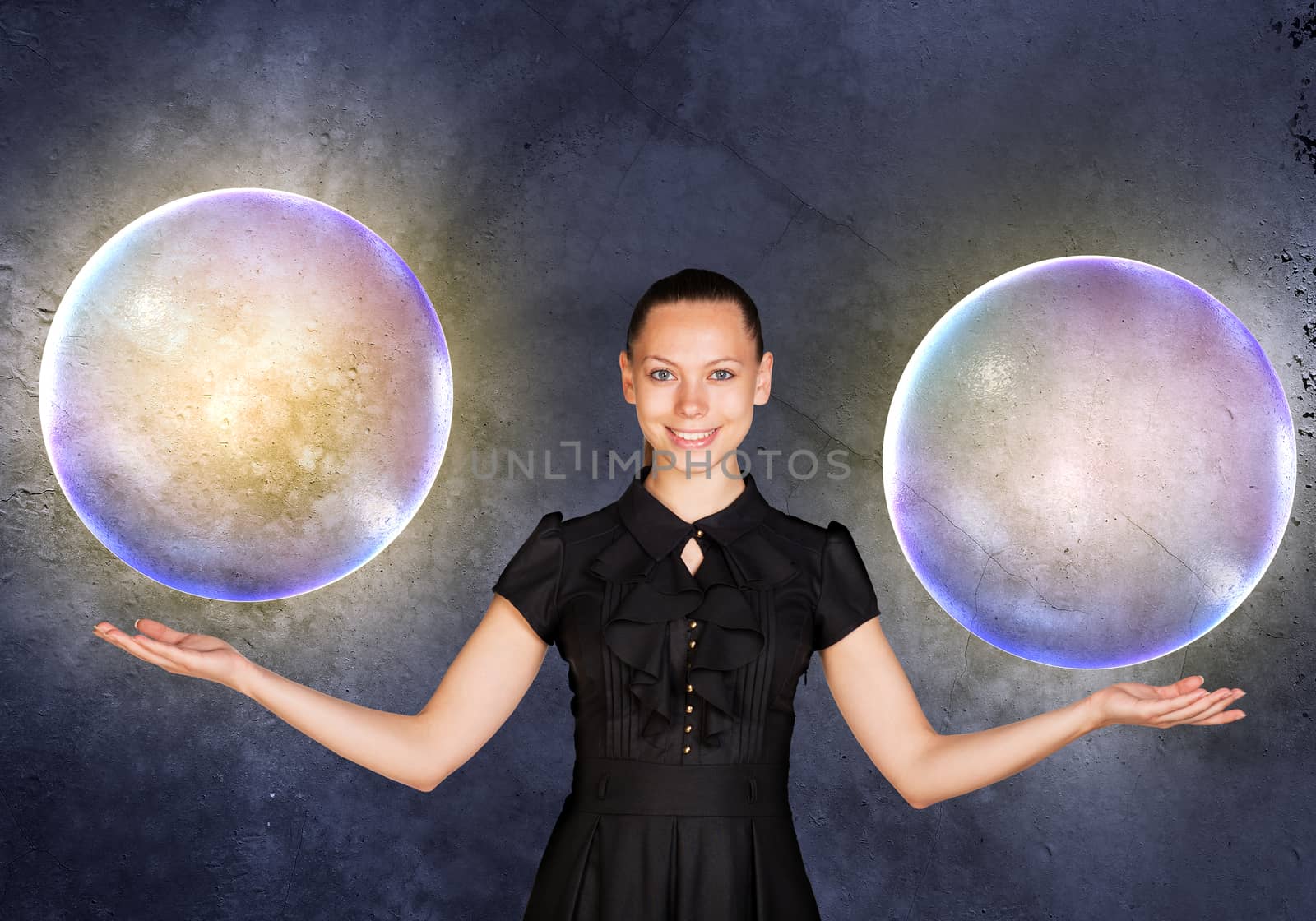 Businesswoman holding two big bubbles by cherezoff