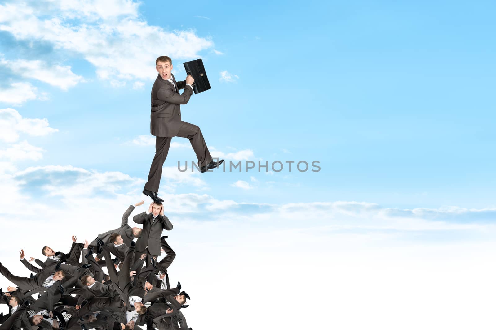 Businessman on pile of people by cherezoff
