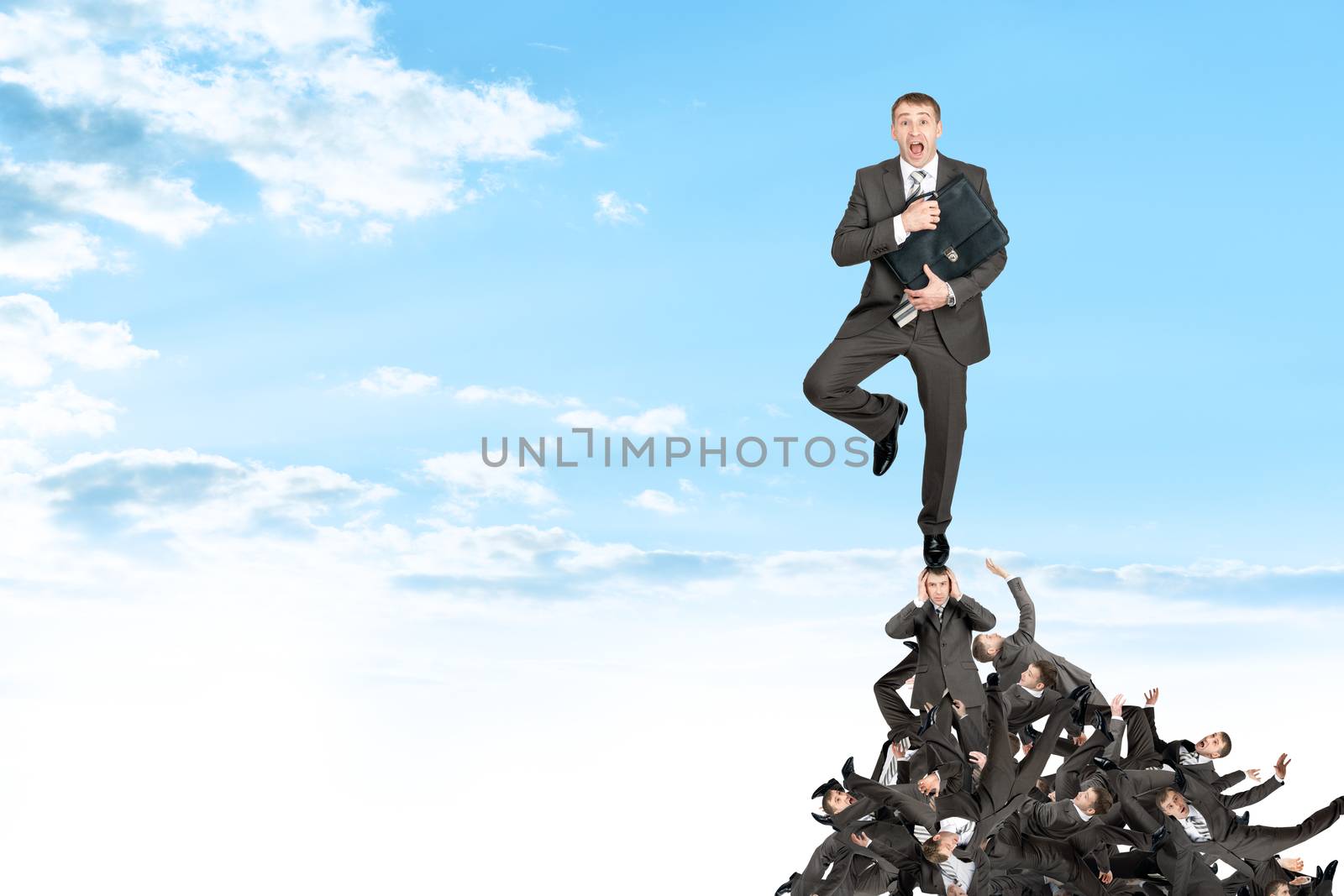 Businessman on pile of people by cherezoff