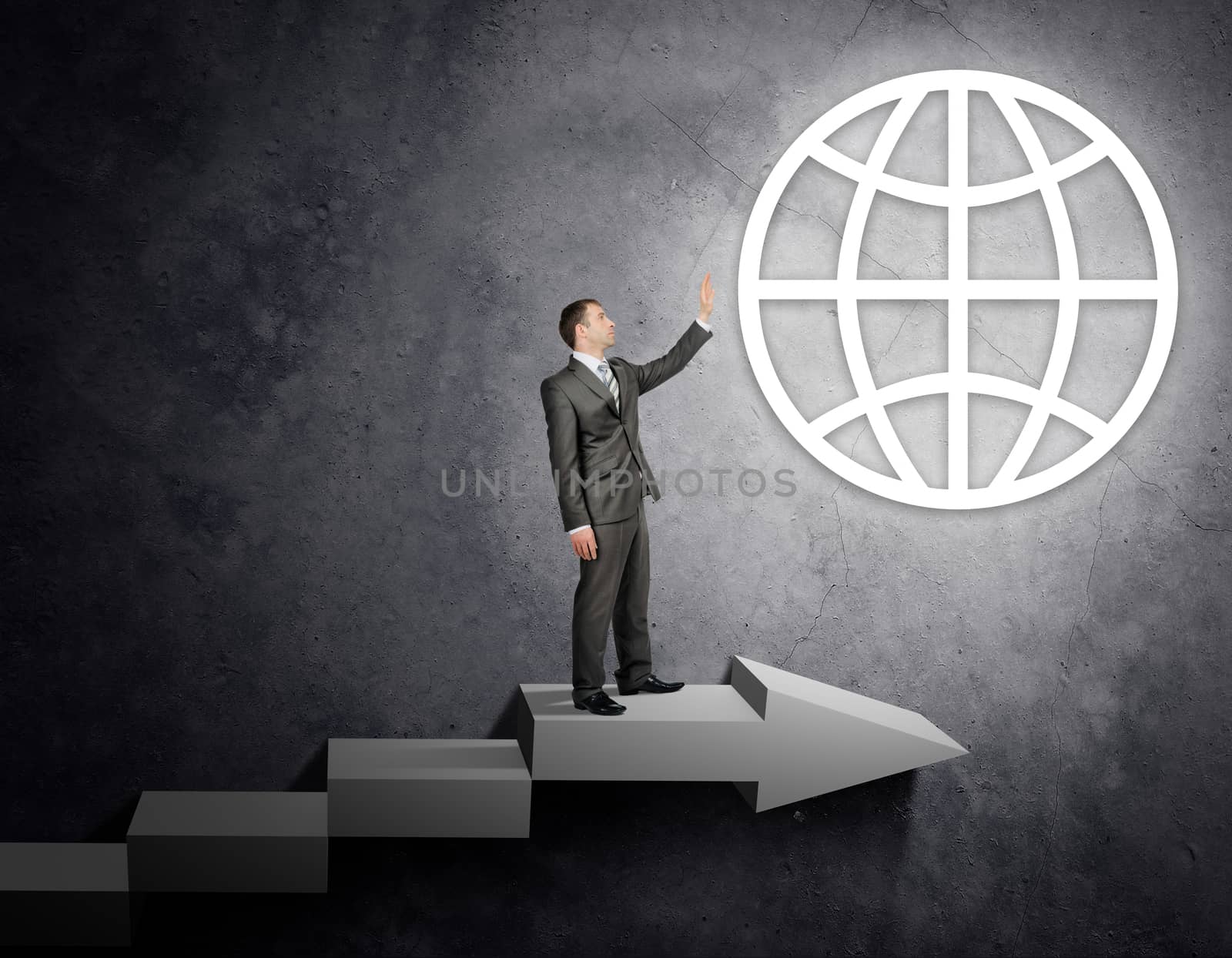 Businessman touching world sign standing on stairs, business concept