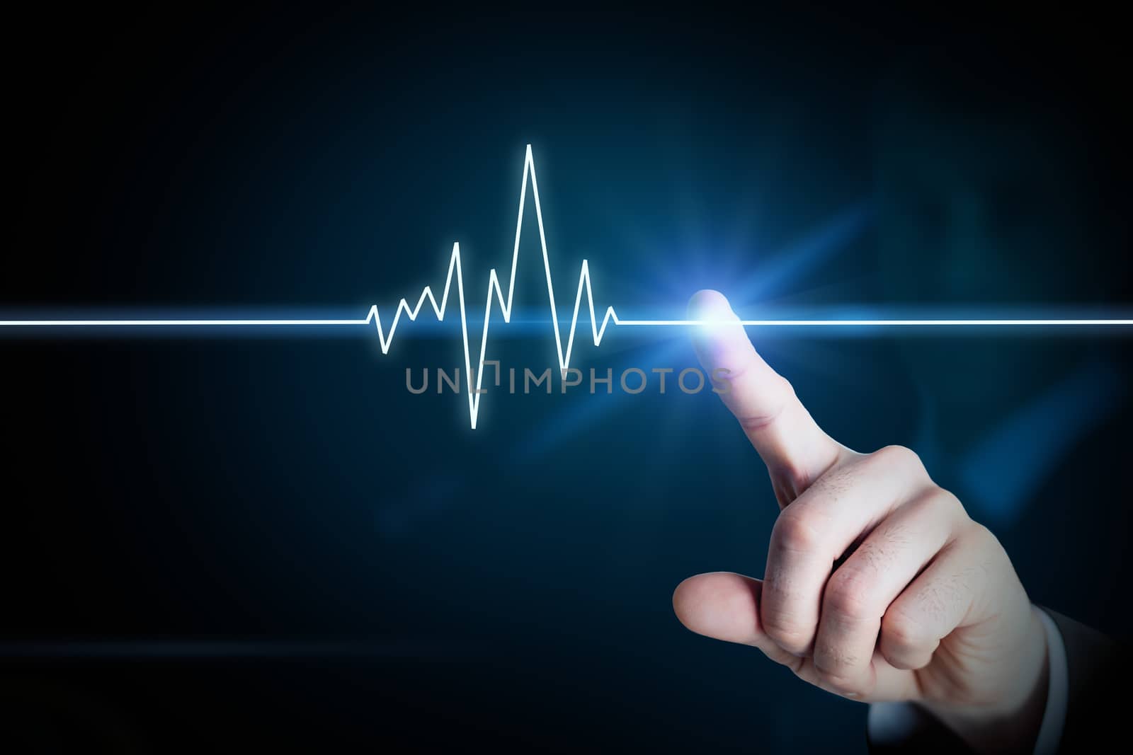 Businessman touching line of heartbeating, medicine concept