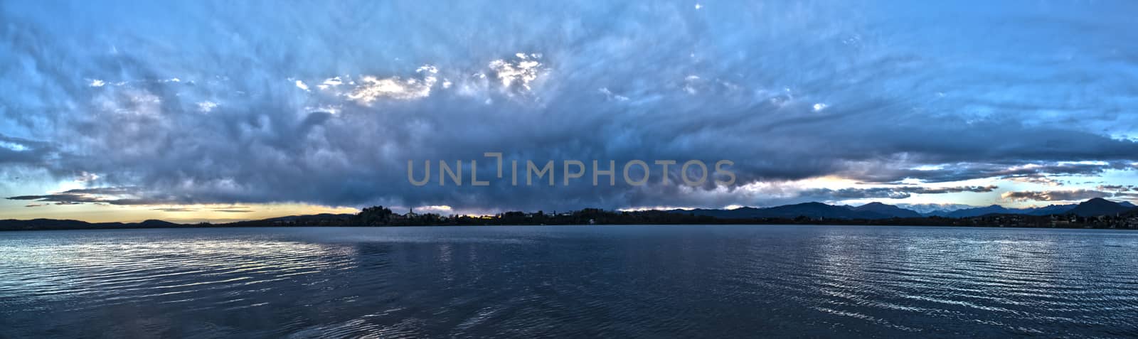 Landscape on the Varese lake with dramatic sky at the sunset, Voltorre di Gavirate - Lombardy, Italy