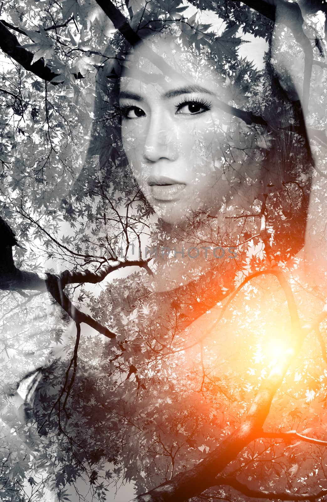 Double exposure portrait of Beautiful girl combined with photograph of nature.