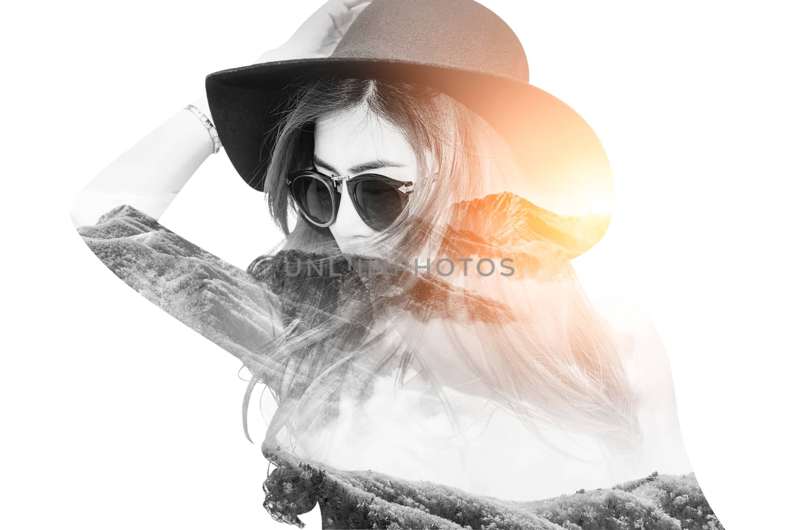 Double exposure portrait of beautiful girl combined with photograph of snowy mountain