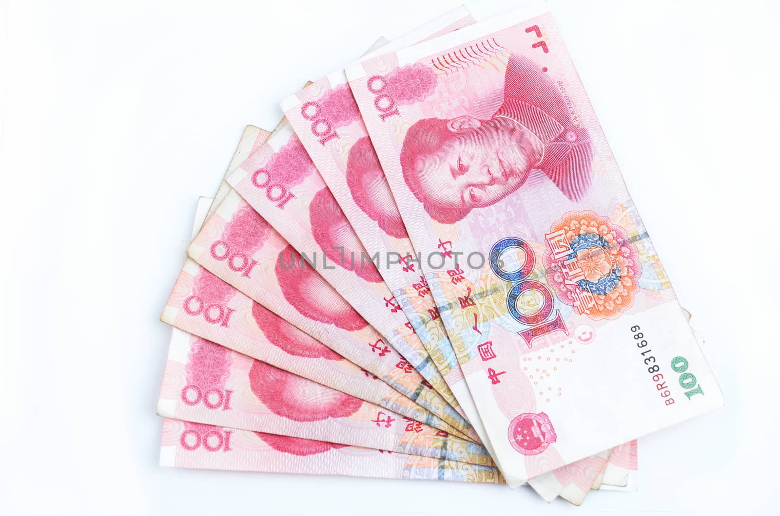 Chinese currency, Yuan, hundred RMB. Colorful photo of same banknotes with Mao Tse-Tung picture.