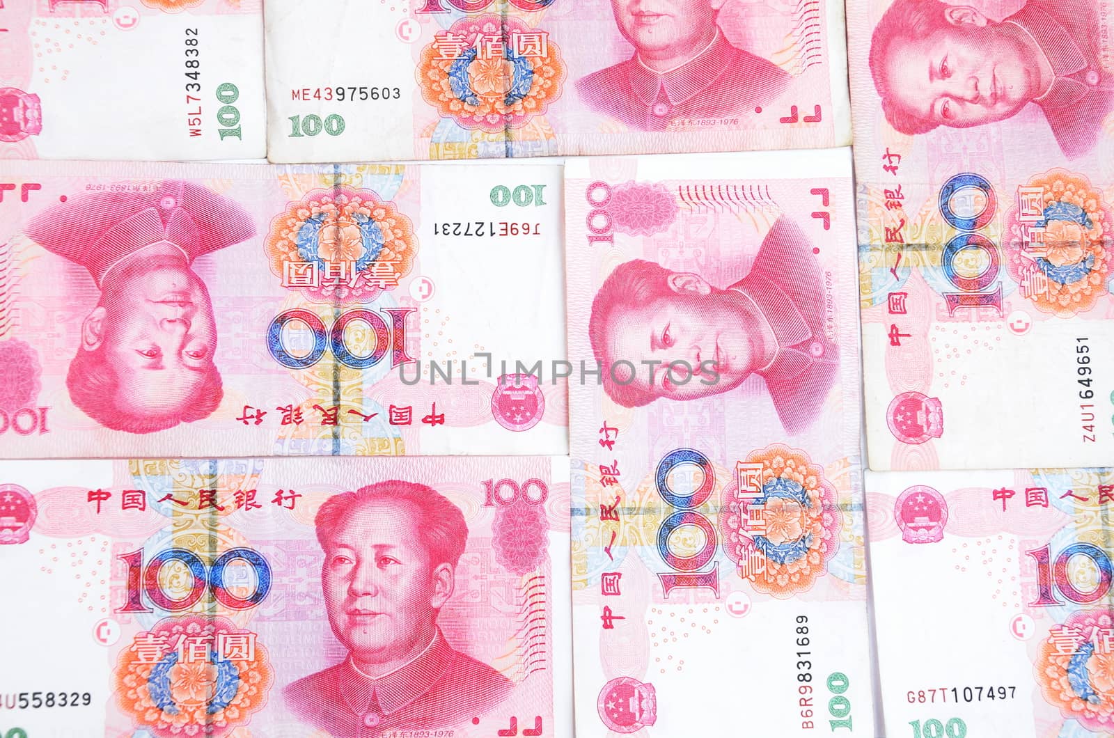 Chinese currency, Yuan, hundred RMB. Colorful photo of same banknotes with Mao Tse-Tung picture.